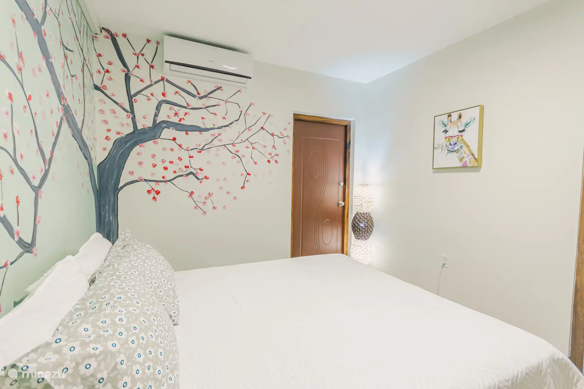 This bedroom has a separate entrance through the rear of the complex