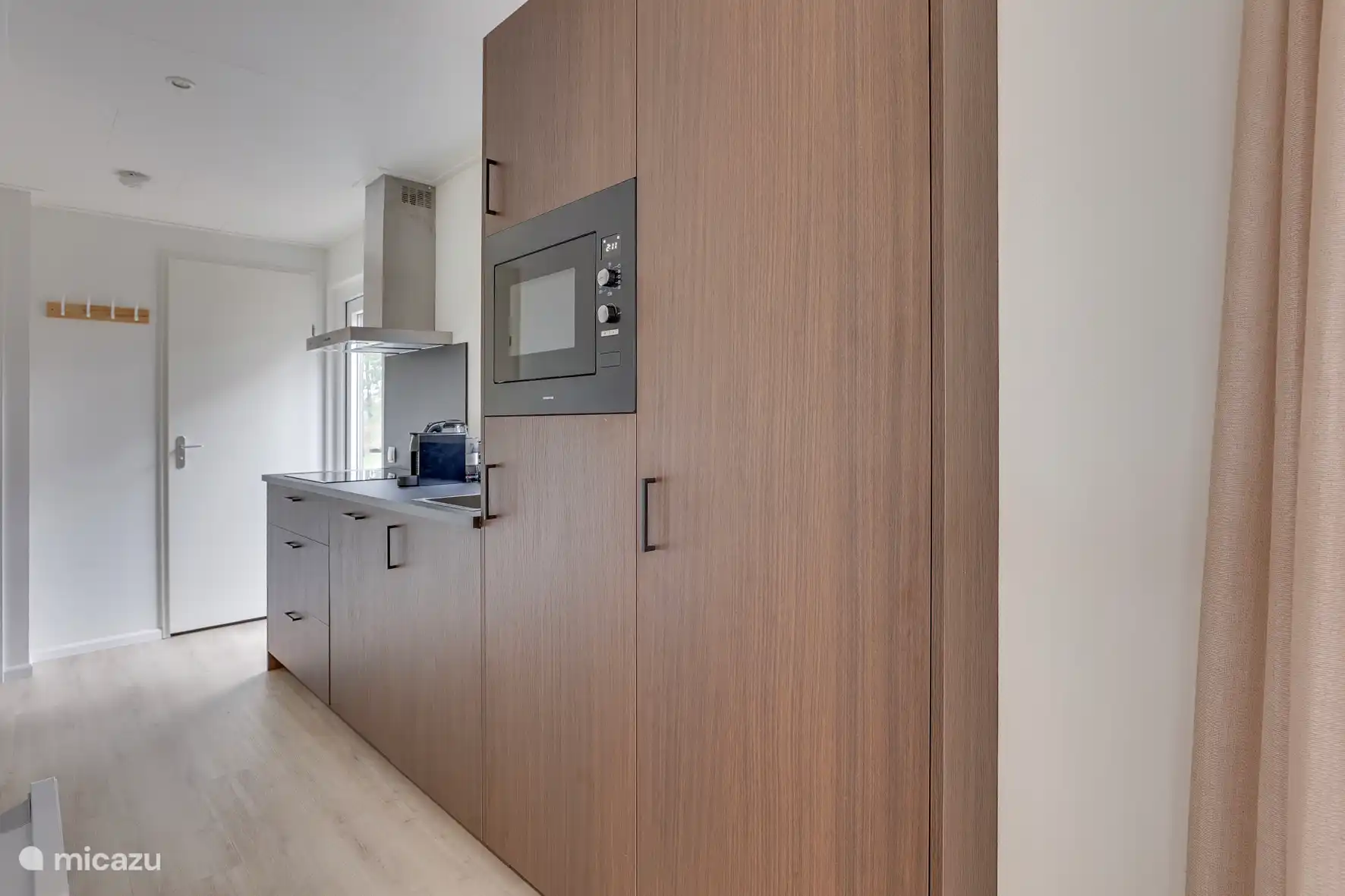 Luxury kitchen with oven and microwave, dishwasher, Nespresso coffee machine, fridge and freezer and all the necessities to prepare a delicious meal
