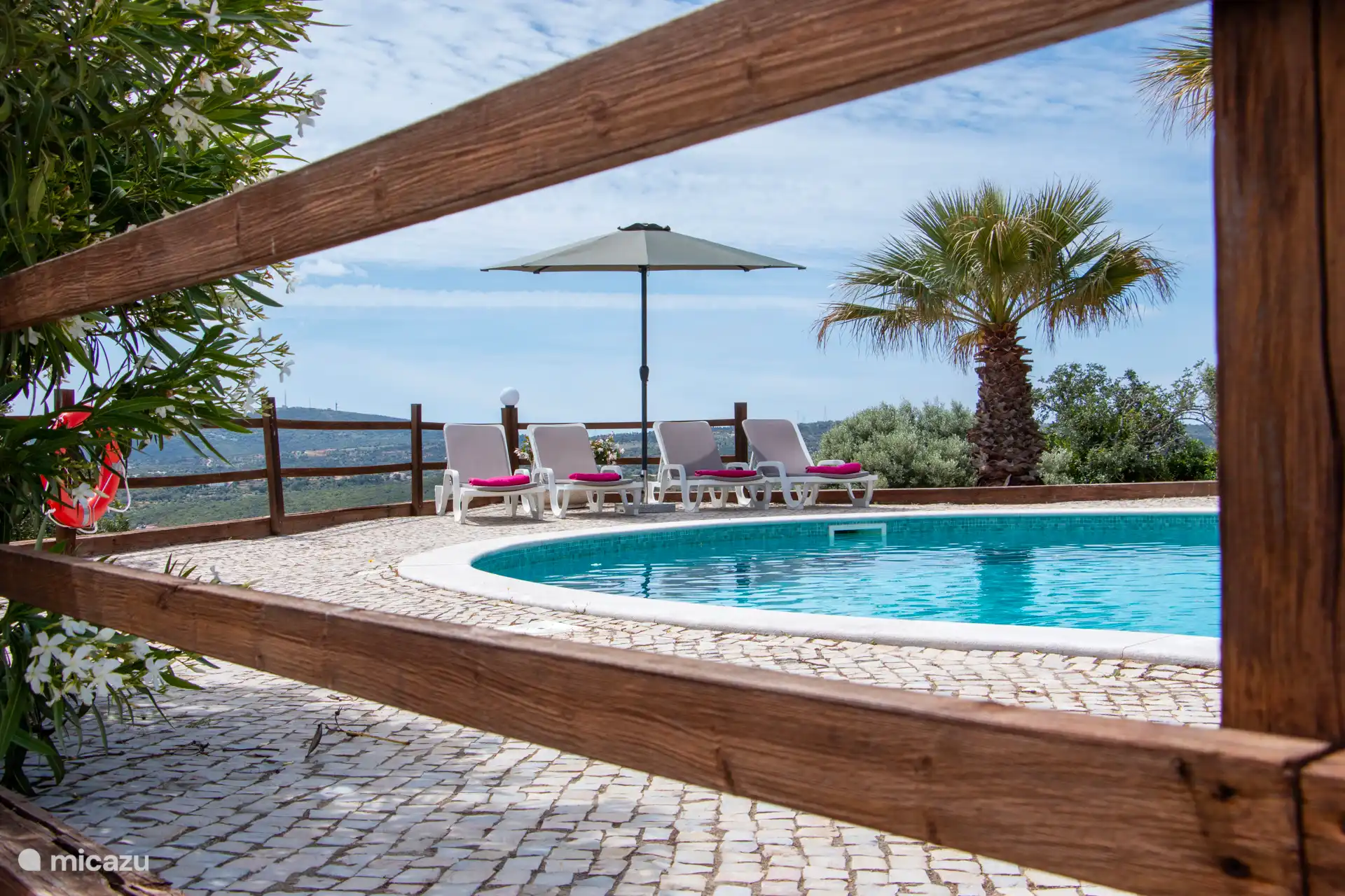 Pool with sunbeds