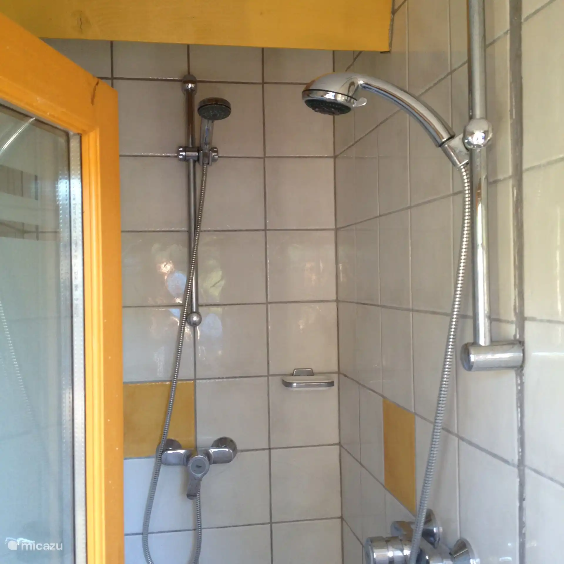 bathroom with double showers