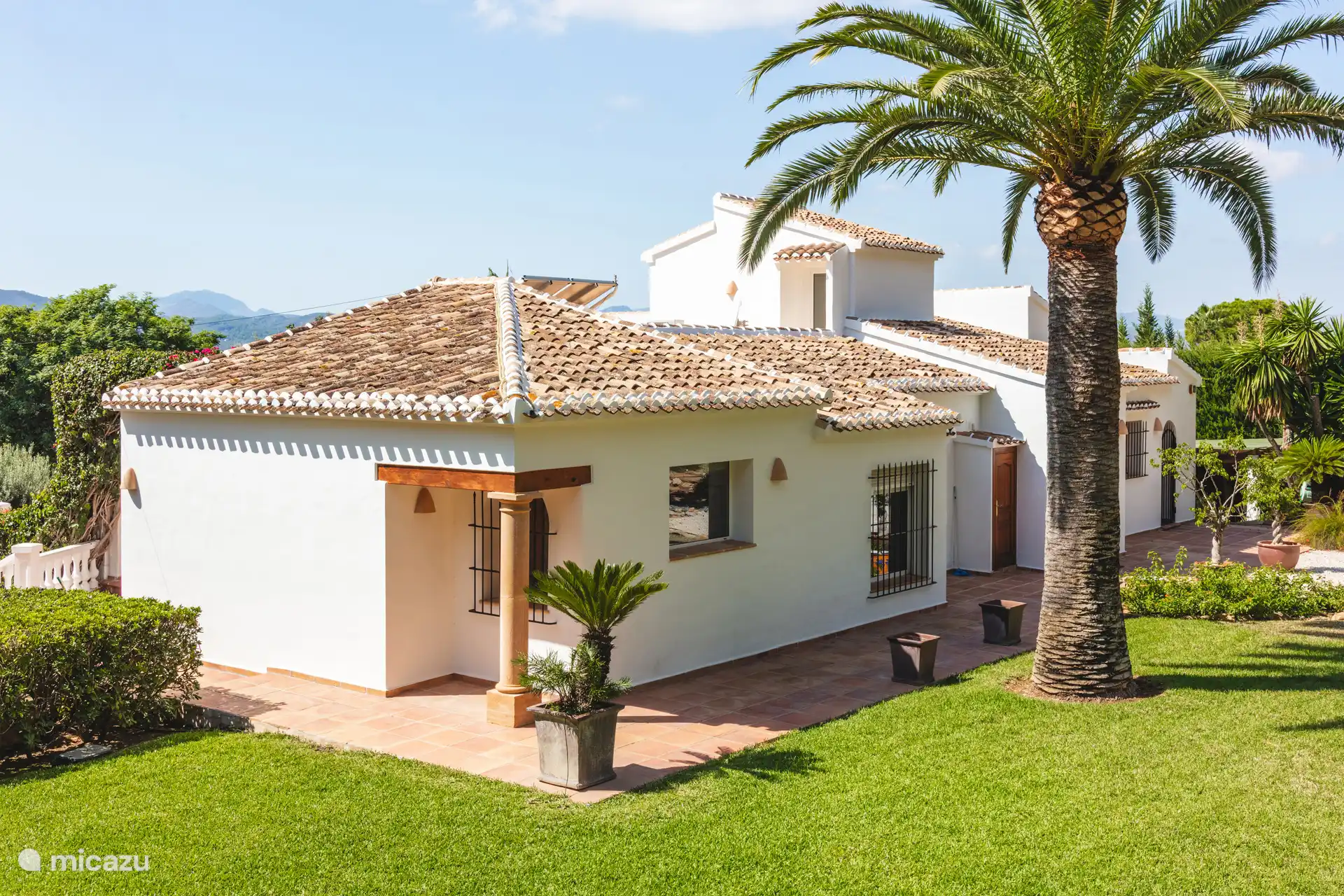 Back of the house, with garden and parking.