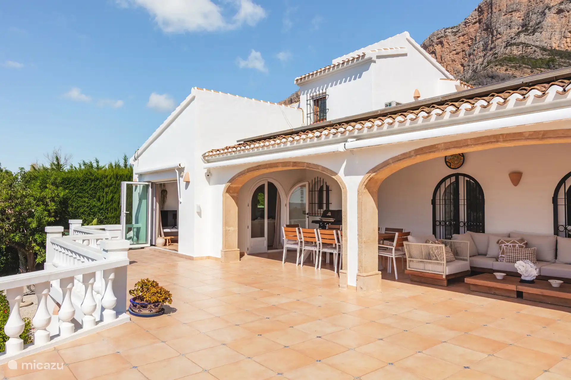 Lovely terrace, with dining table and large lounge seat.