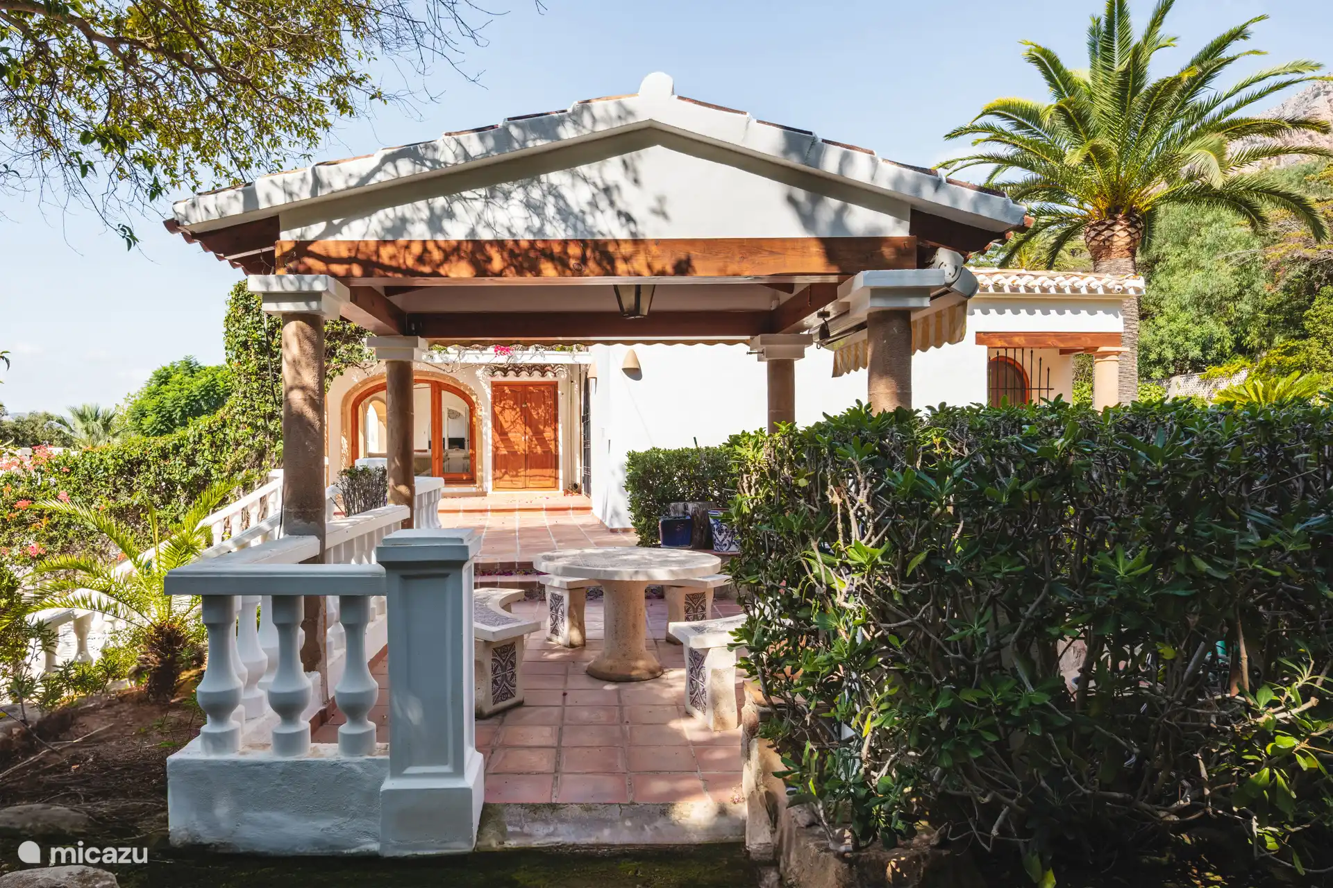 Original Spanish patio with stone table and bench.