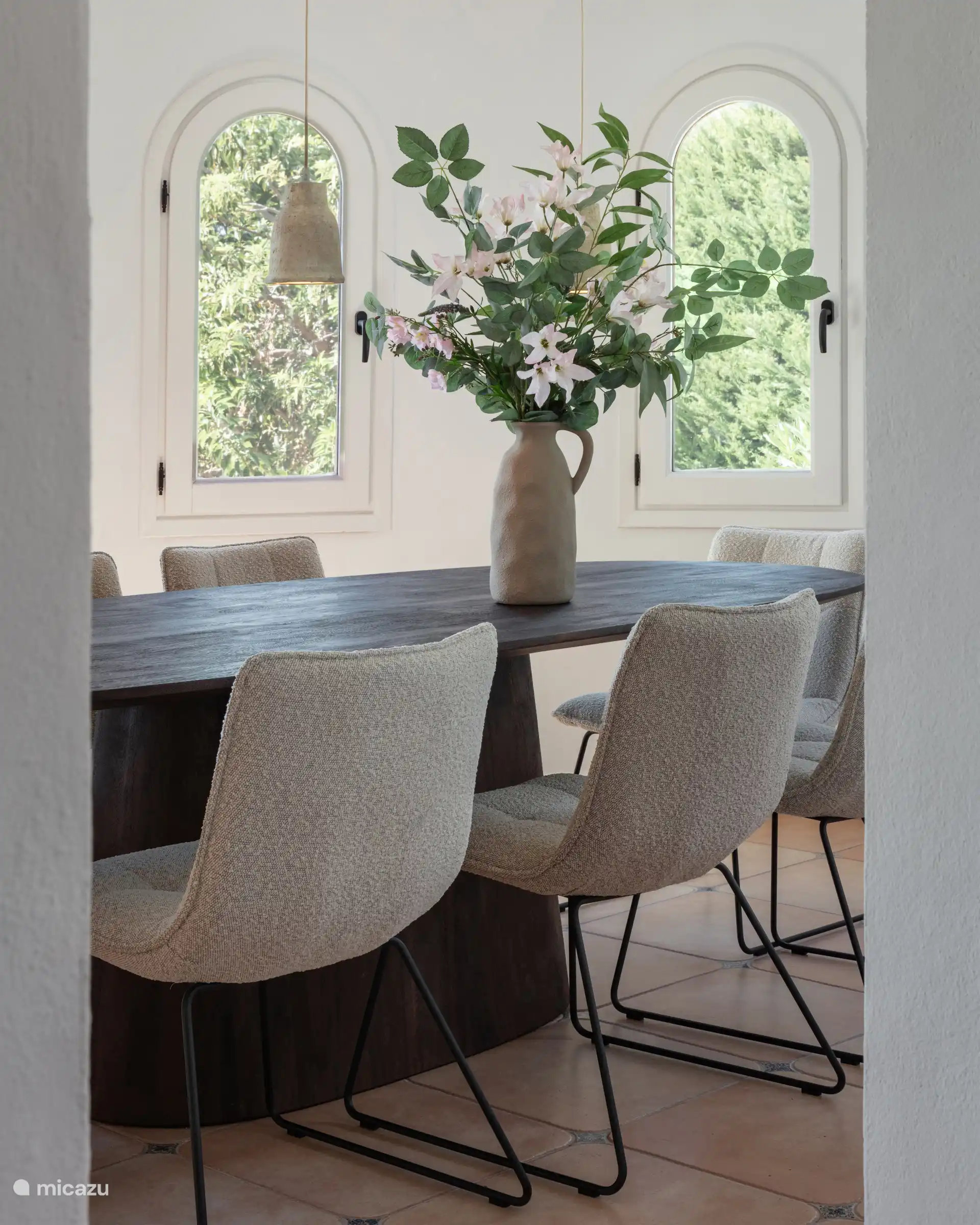 Beautiful oval dining table with comfortable chairs.