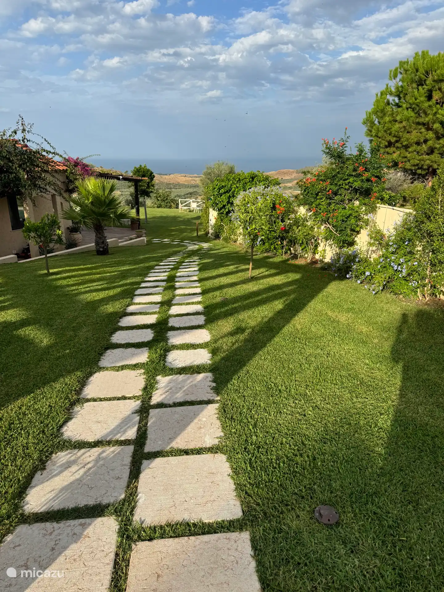 The path from the parking lot to the house.