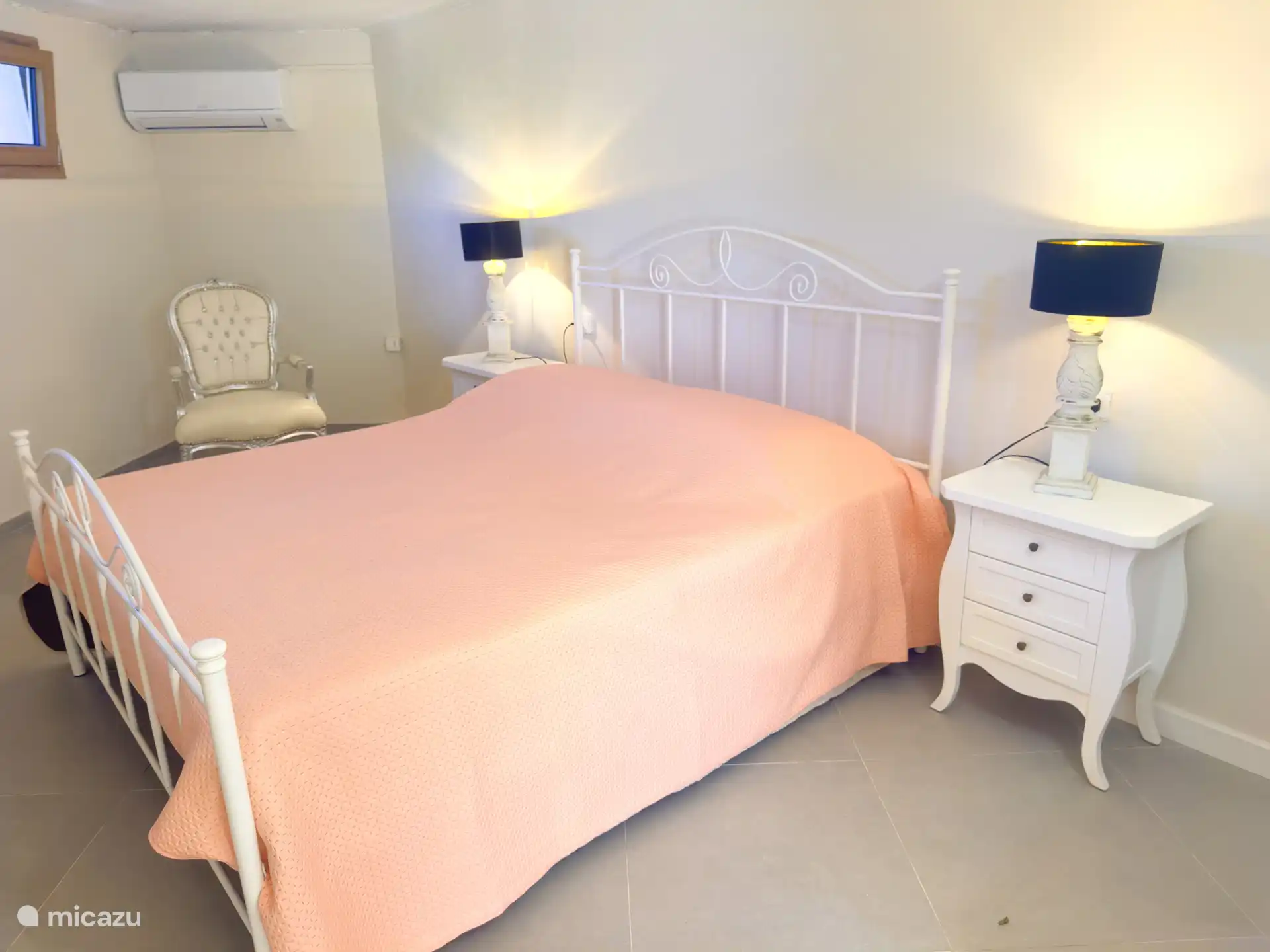 The fourth bedroom is located in the pool house, under the pool. The bedroom has an en-suite bathroom with shower.