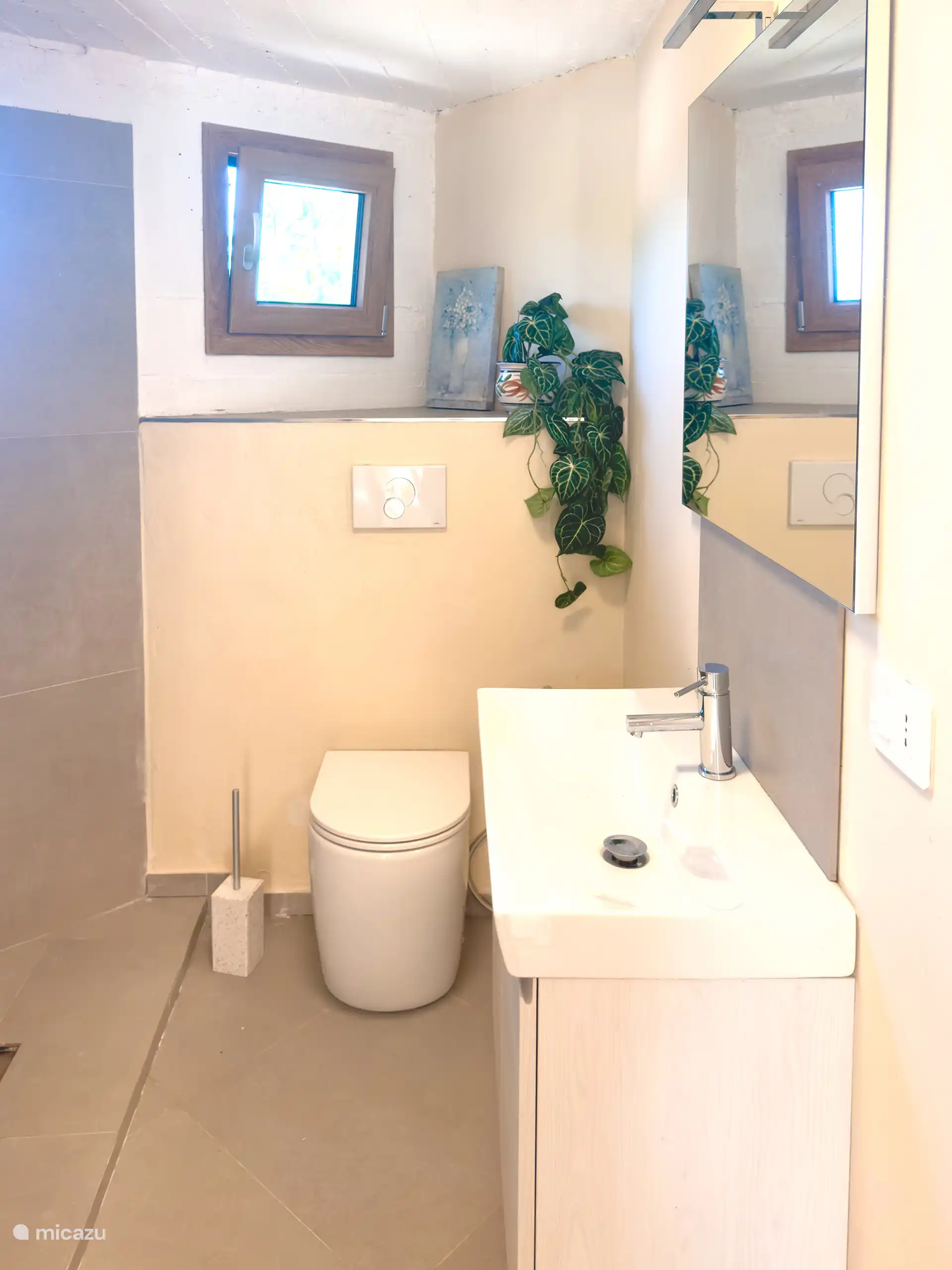 The third bathroom is located in the pool house near bedroom 4. 