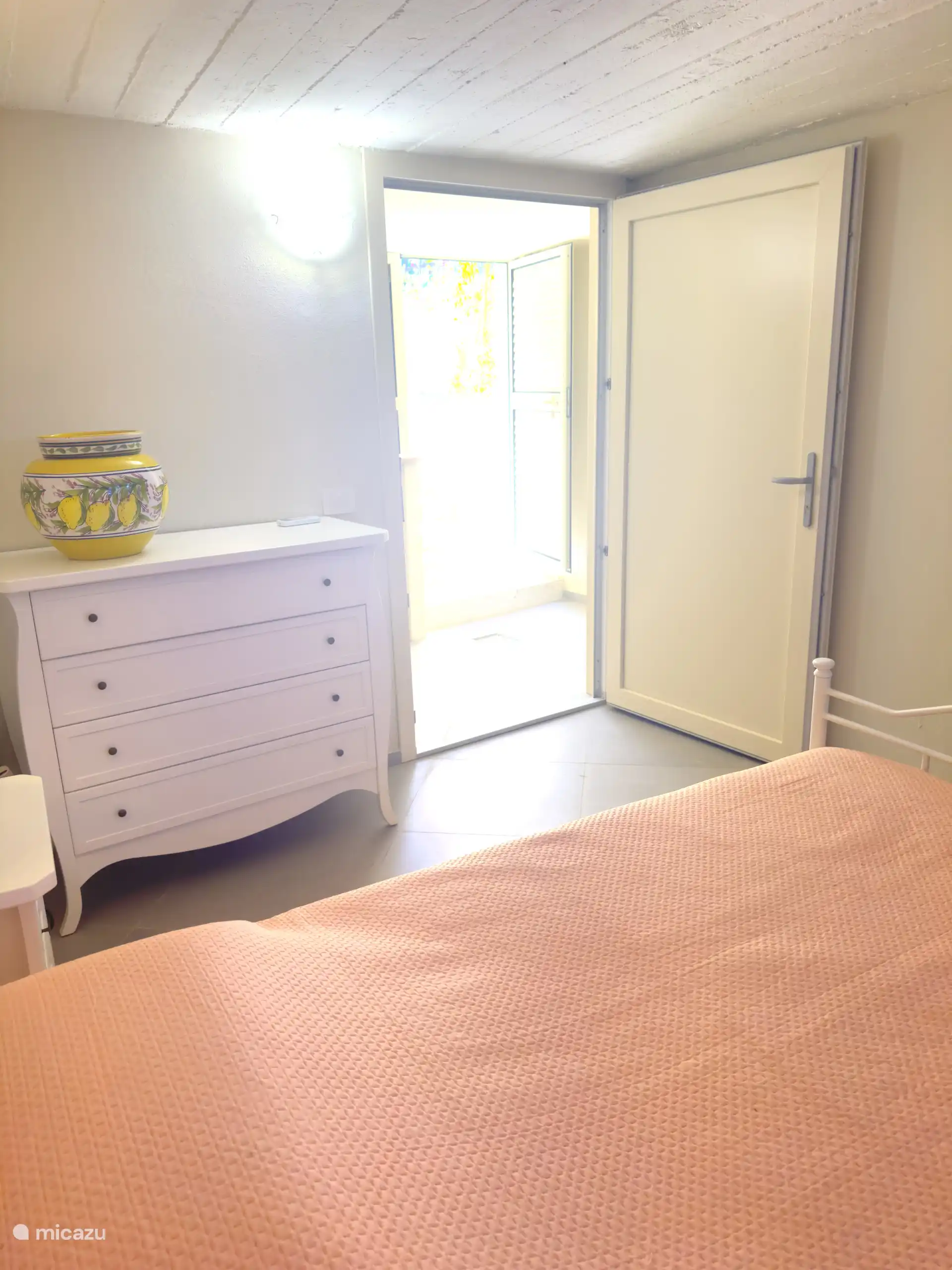 The fourth bedroom is located in the pool house, under the pool. The bedroom has an en-suite bathroom with shower.