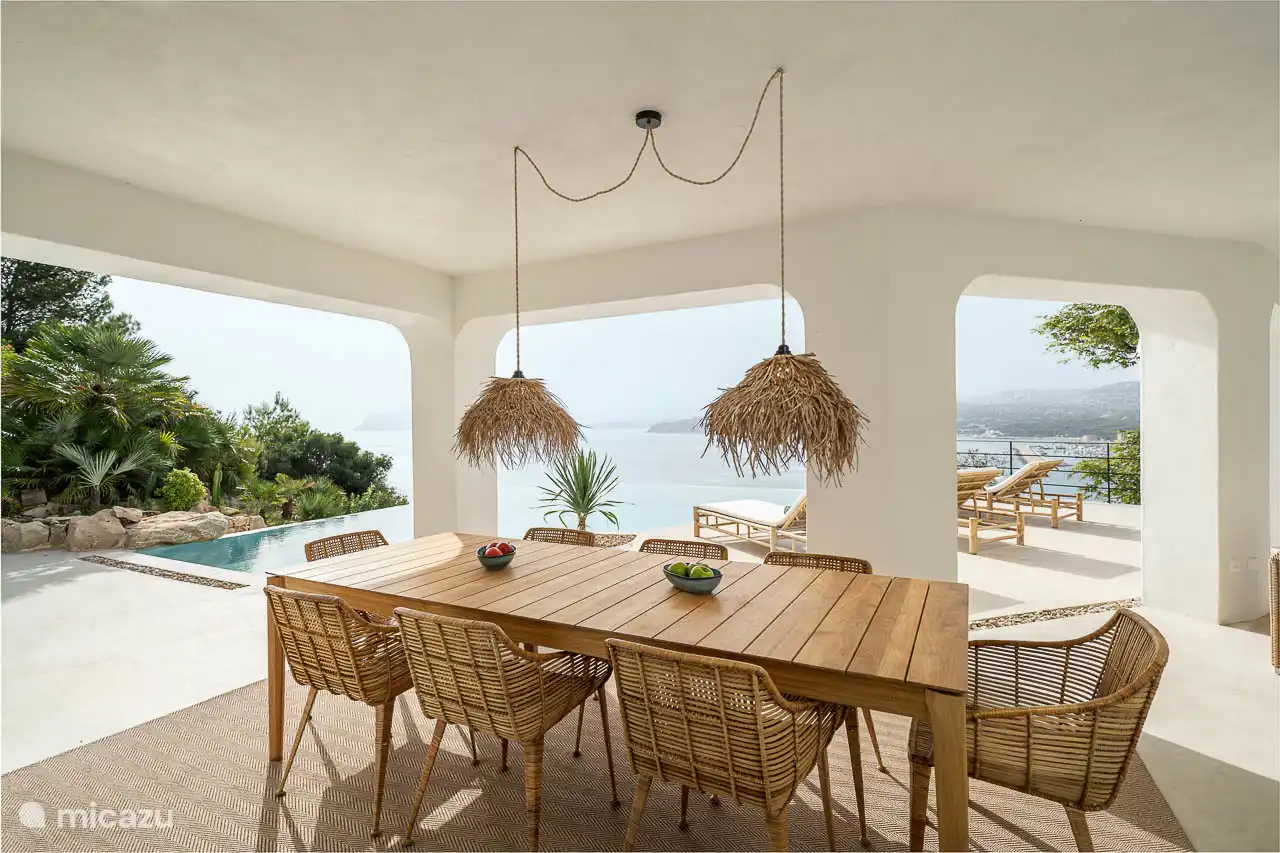 Covered terrace with panoramic sea views.