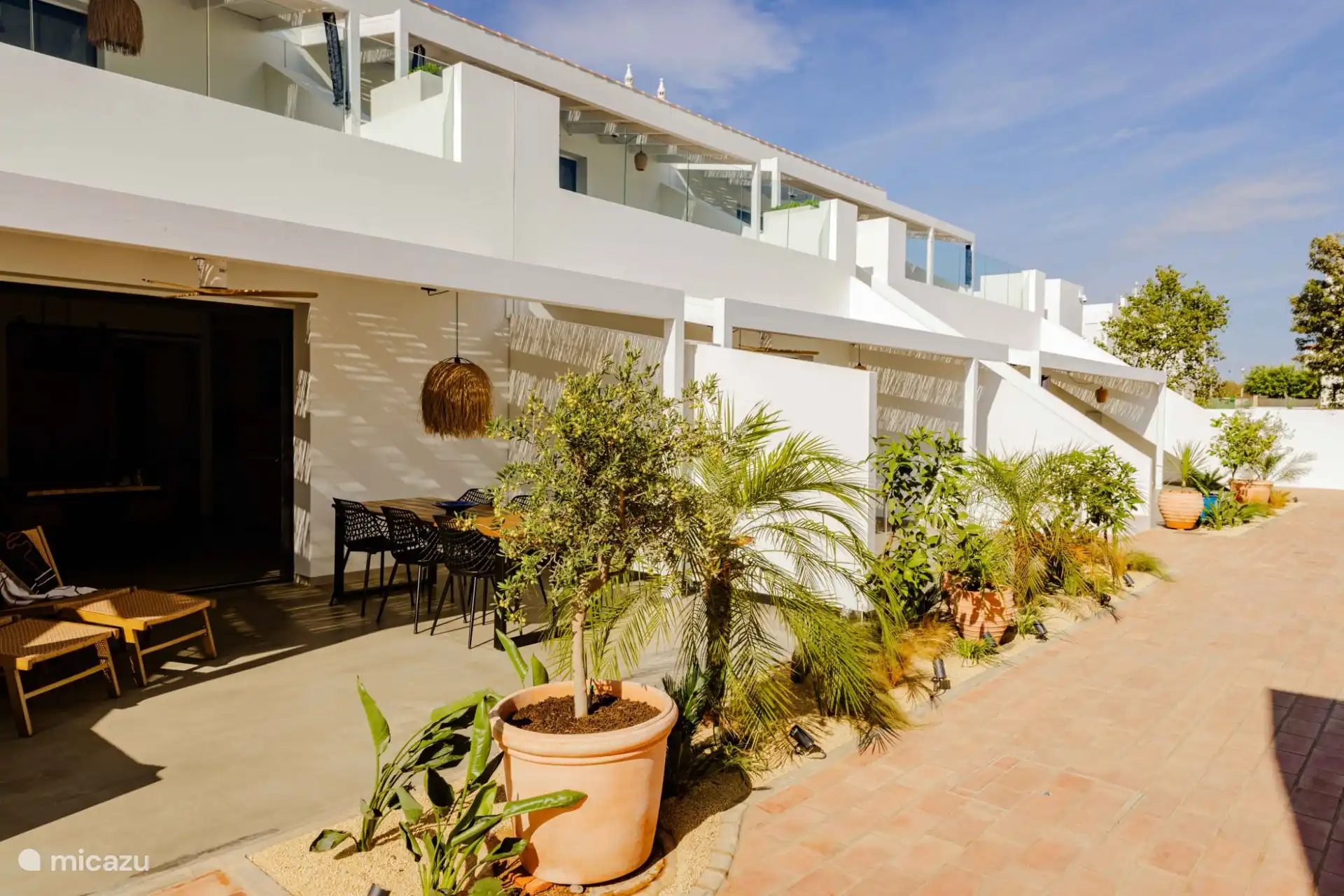 Privéterras en gemeenschappelijke tuin Celebra a Vida Resort