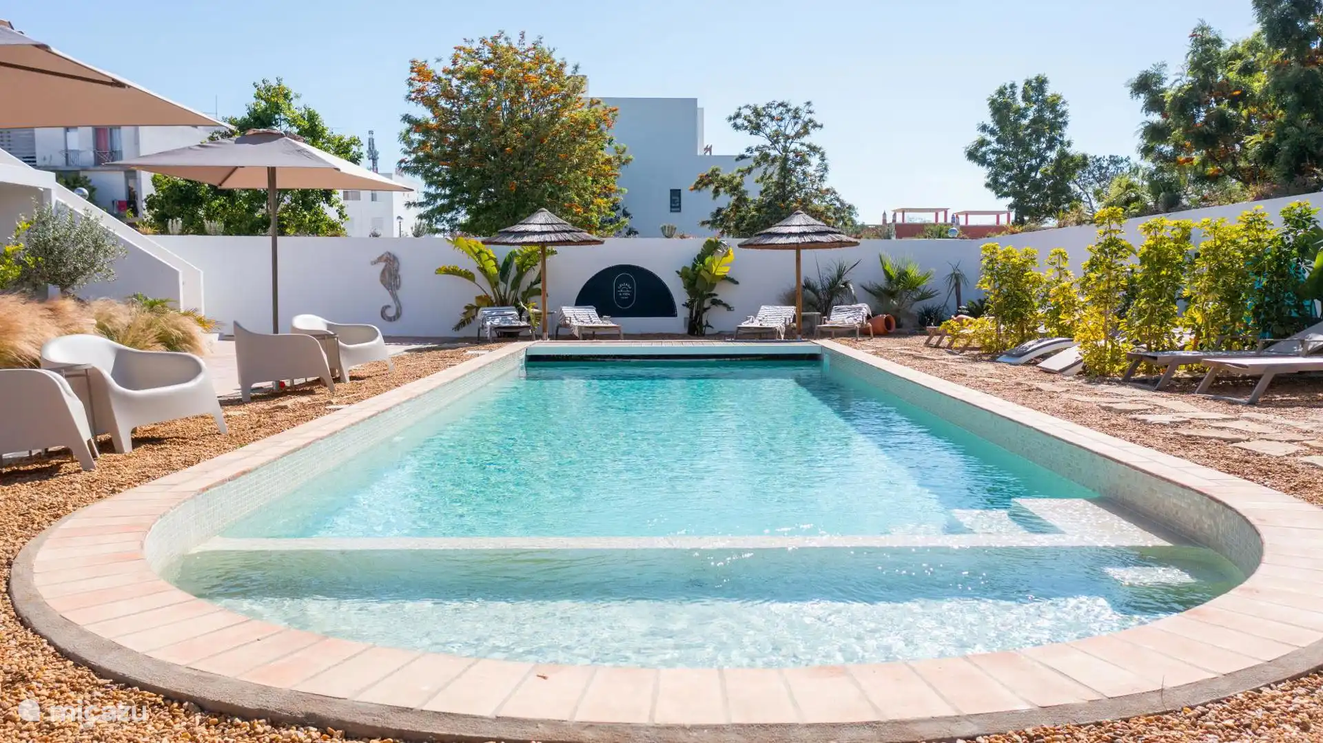 Gemeenschappelijk zwembad en tropische tuin Celebra a Vida Resort