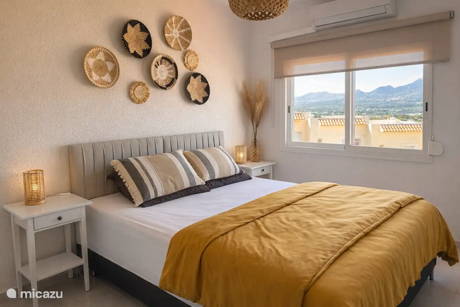Bedroom with double bed and mountain view