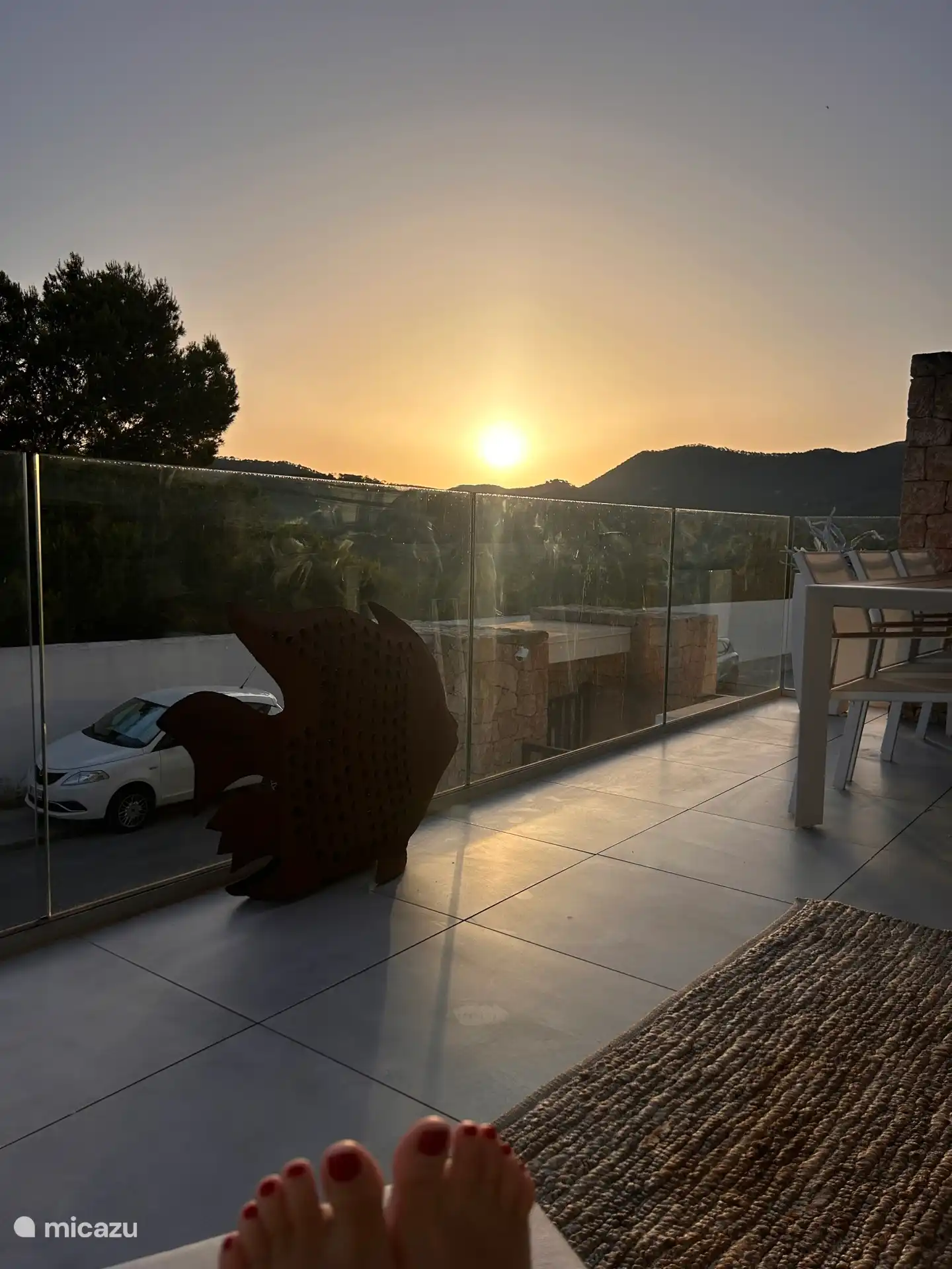 Zonsopgang, op het terras van het appartement.