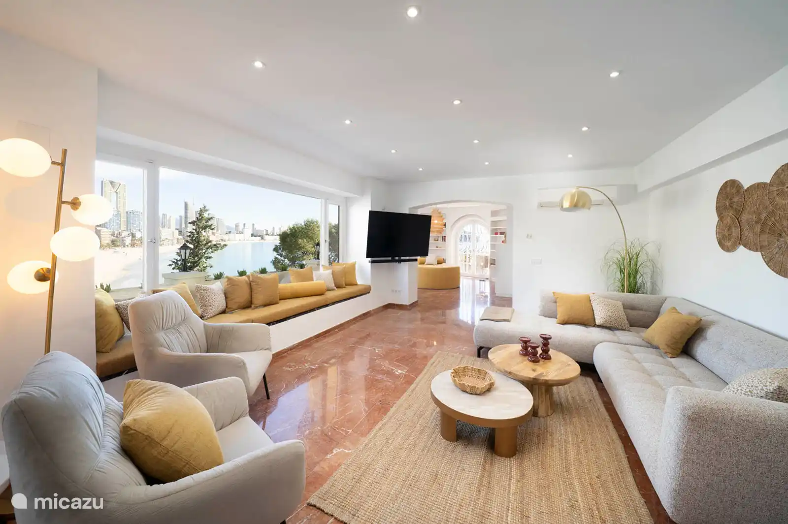 Living room with sofas, TV, air conditioning, access to terrace, sea view.