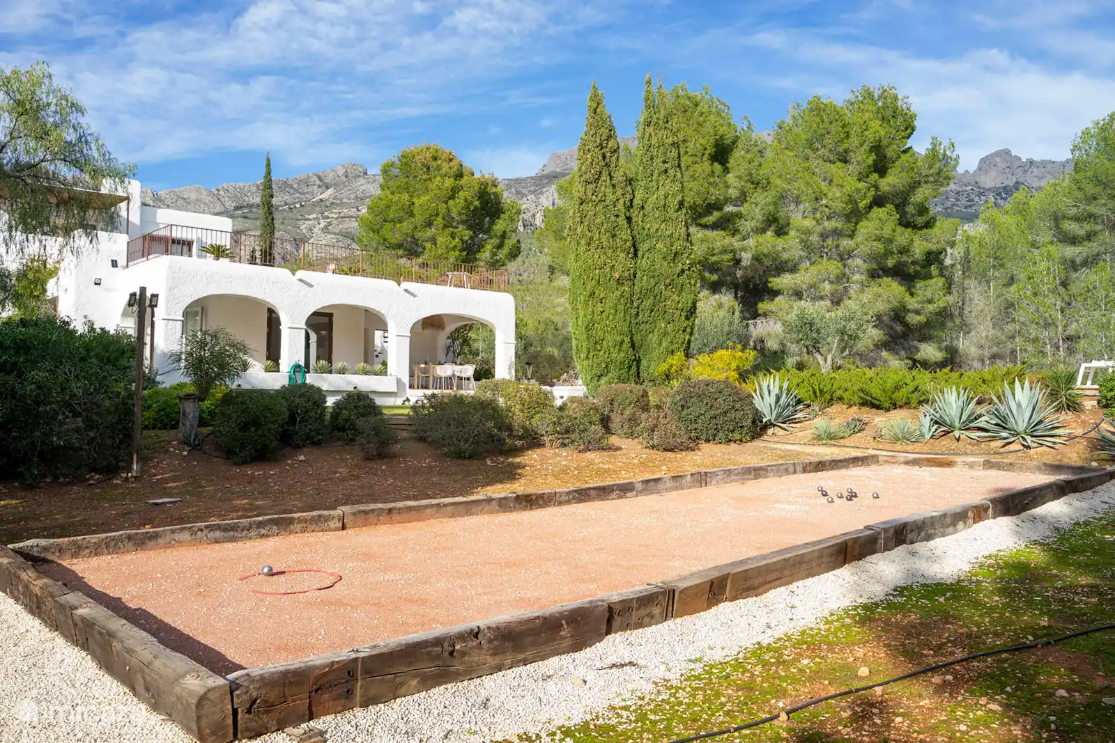 Petanque games in the garden surrounded by nature.