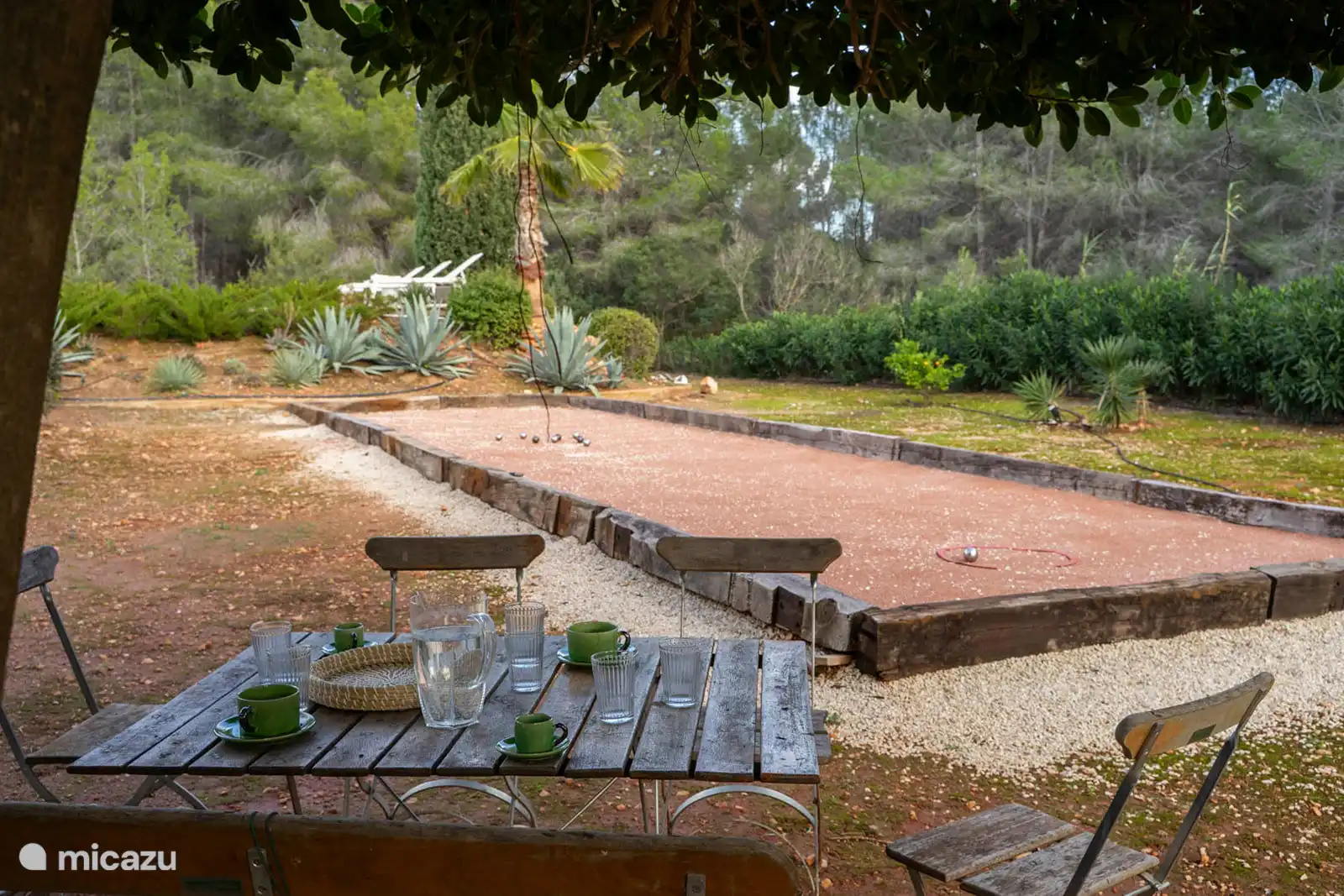 Petanque games in the garden surrounded by nature.