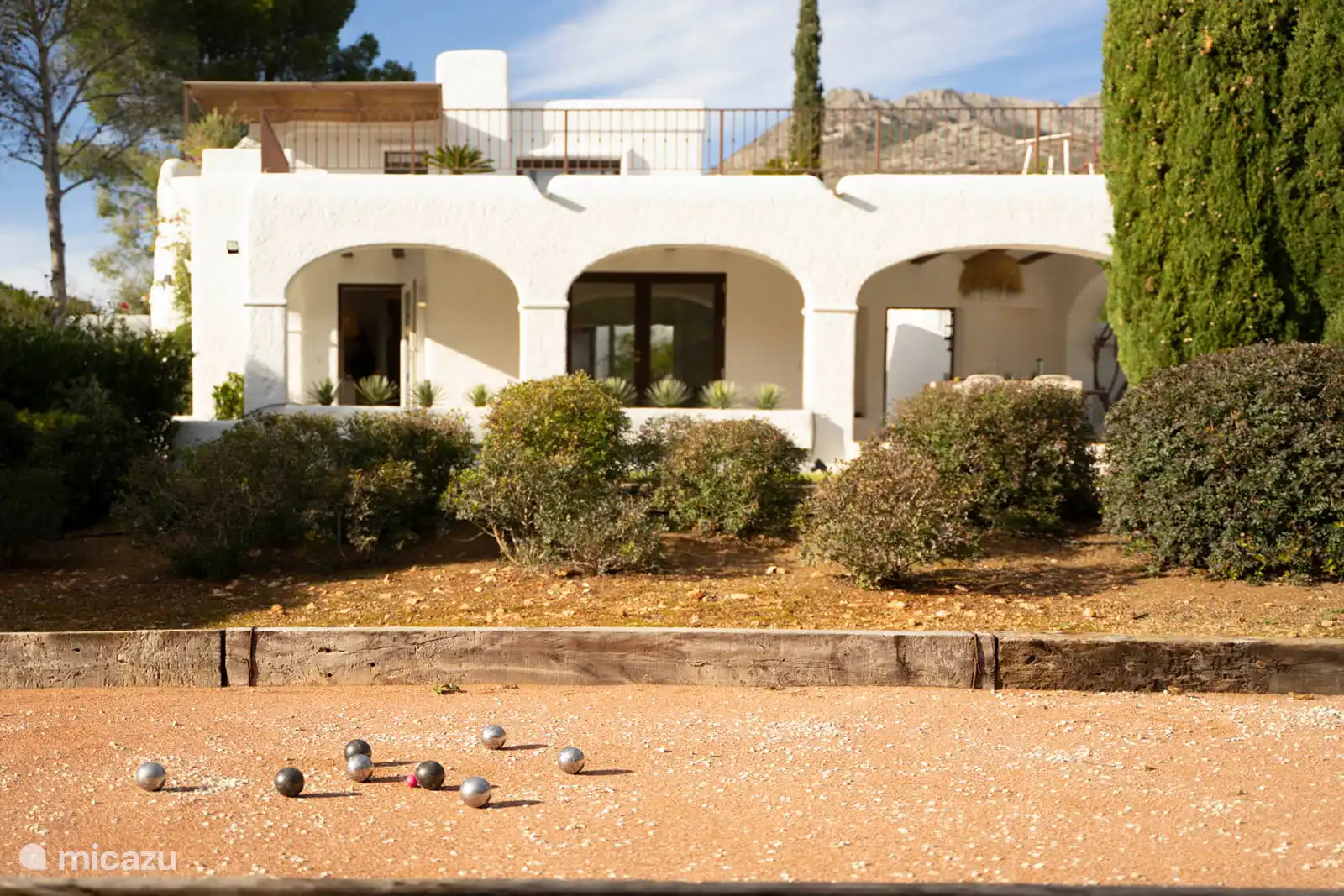Petanque games in the garden surrounded by nature.