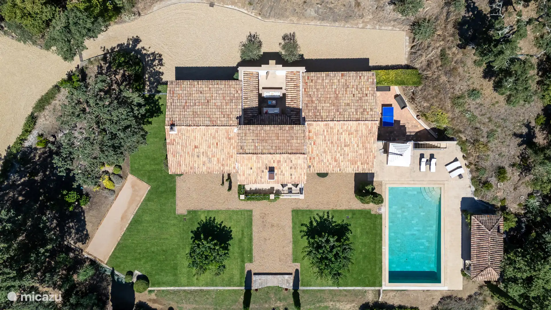 House seen from aerial view with swimming pool, tennis court, pétanque court and table tennis table
