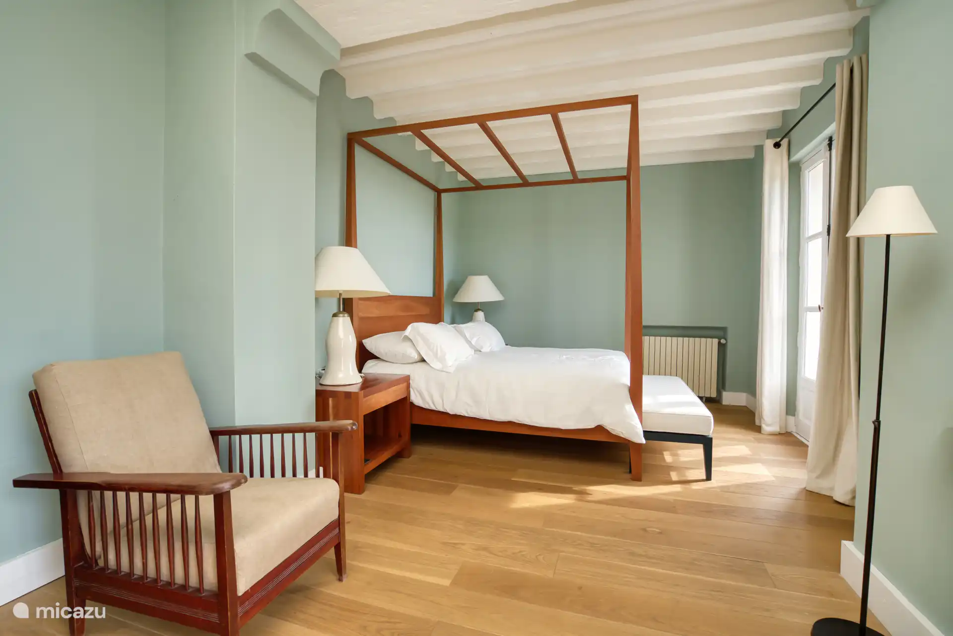 Main bedroom with A/C, TV, balcony