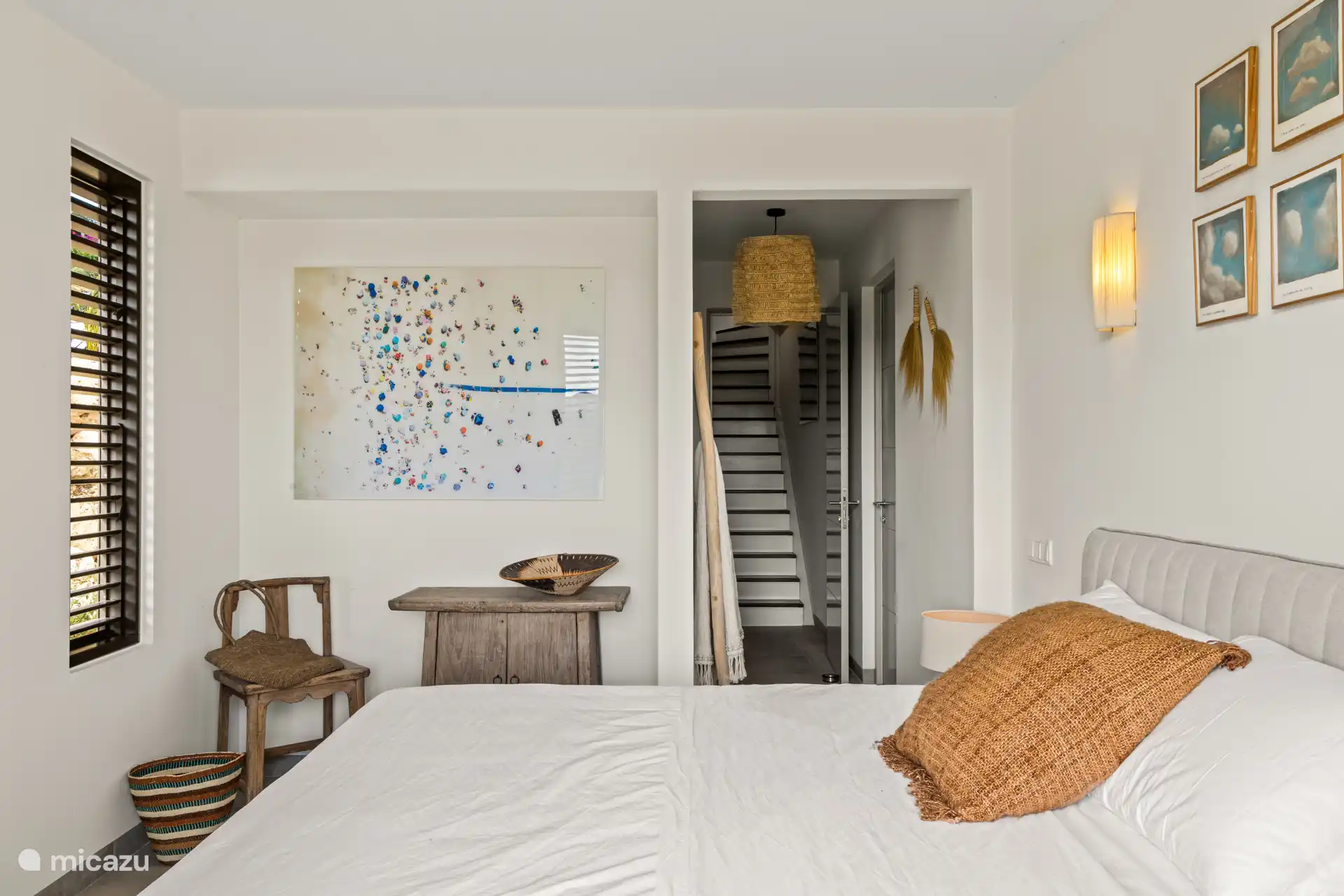 Bedroom 4, stairs down, with double bed, private bathroom, TV and a/c.