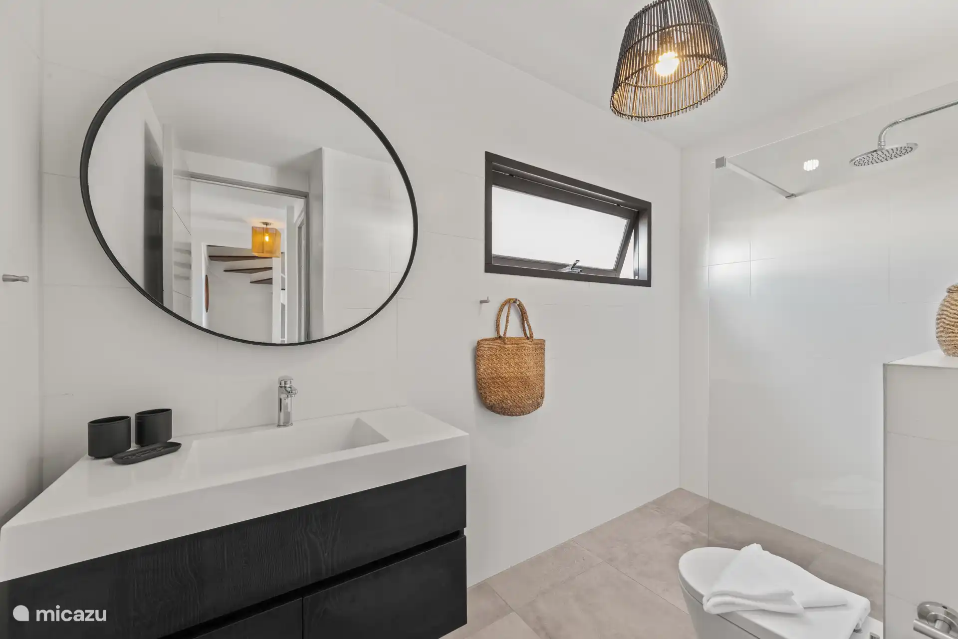 Nice bathroom, with rain shower, toilet, and spacious sink