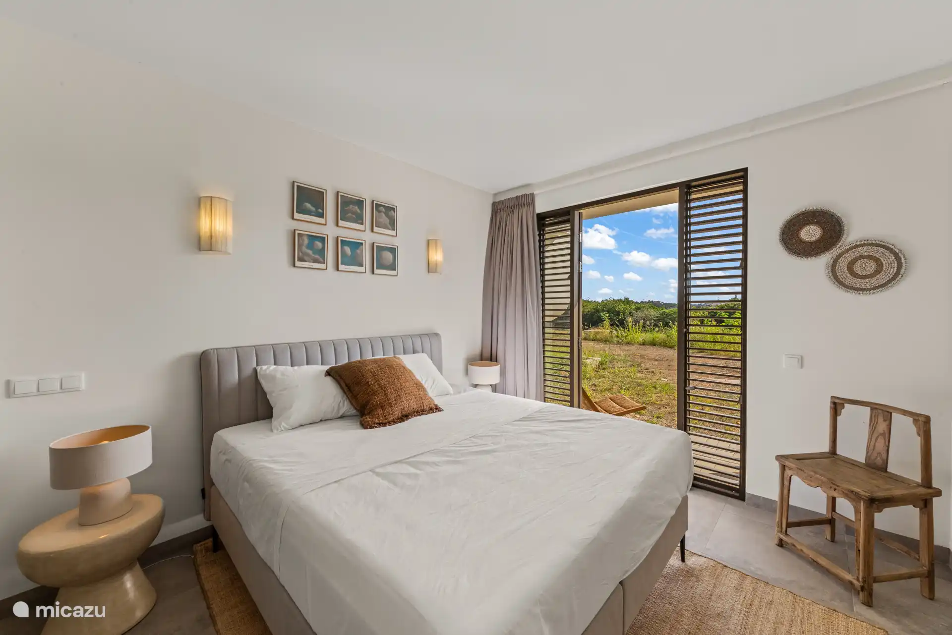 The fourth bedroom is located on the lower floor with direct access to the garden.