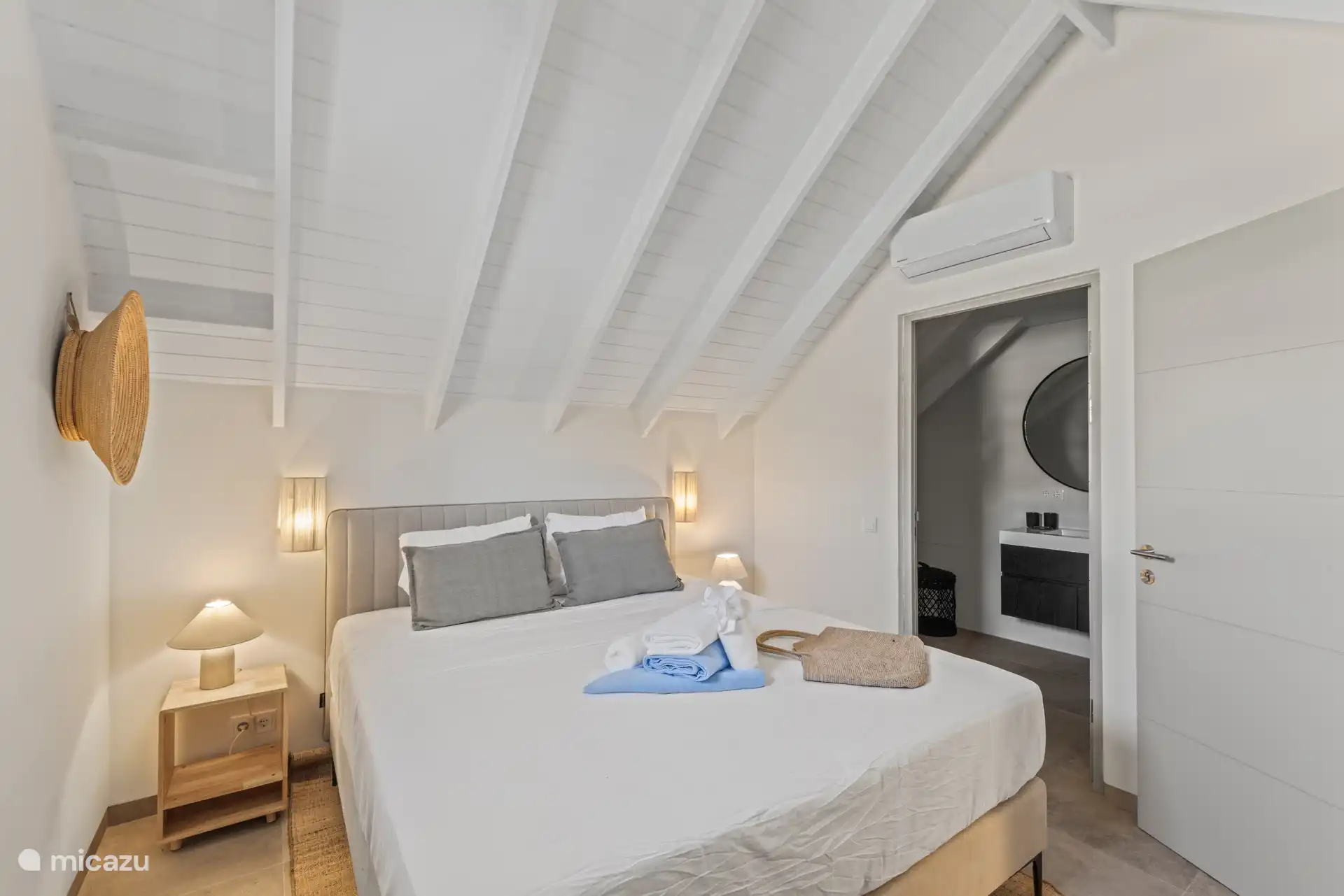 Bedroom 3 on the first floor with double bed, private bathroom, TV, wardrobe and a/c.