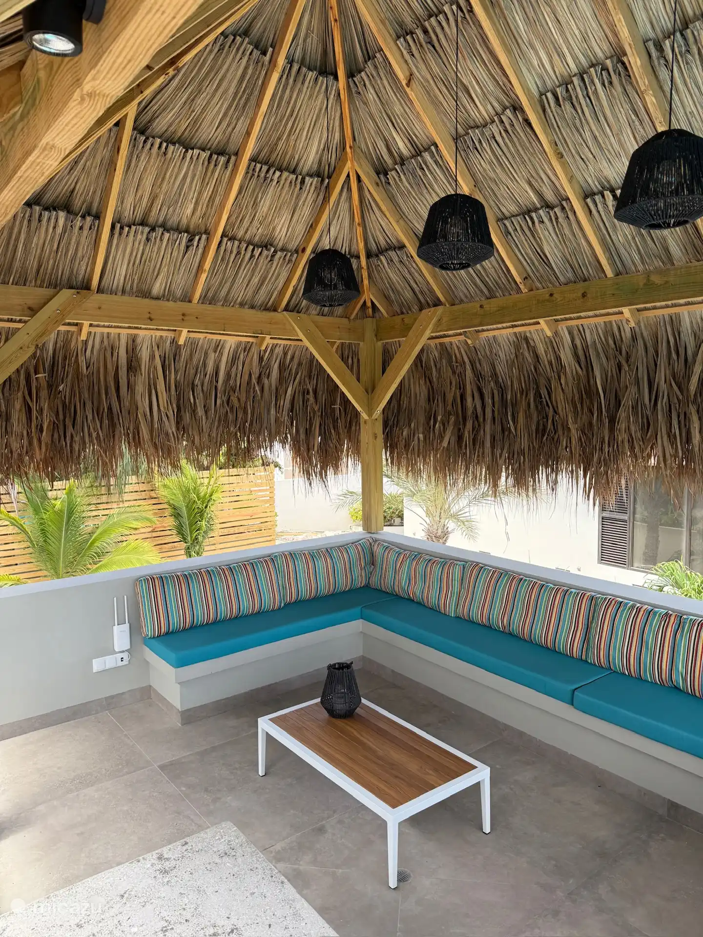 Una zona de estar preciosa en la palapa, junto a la palapa.