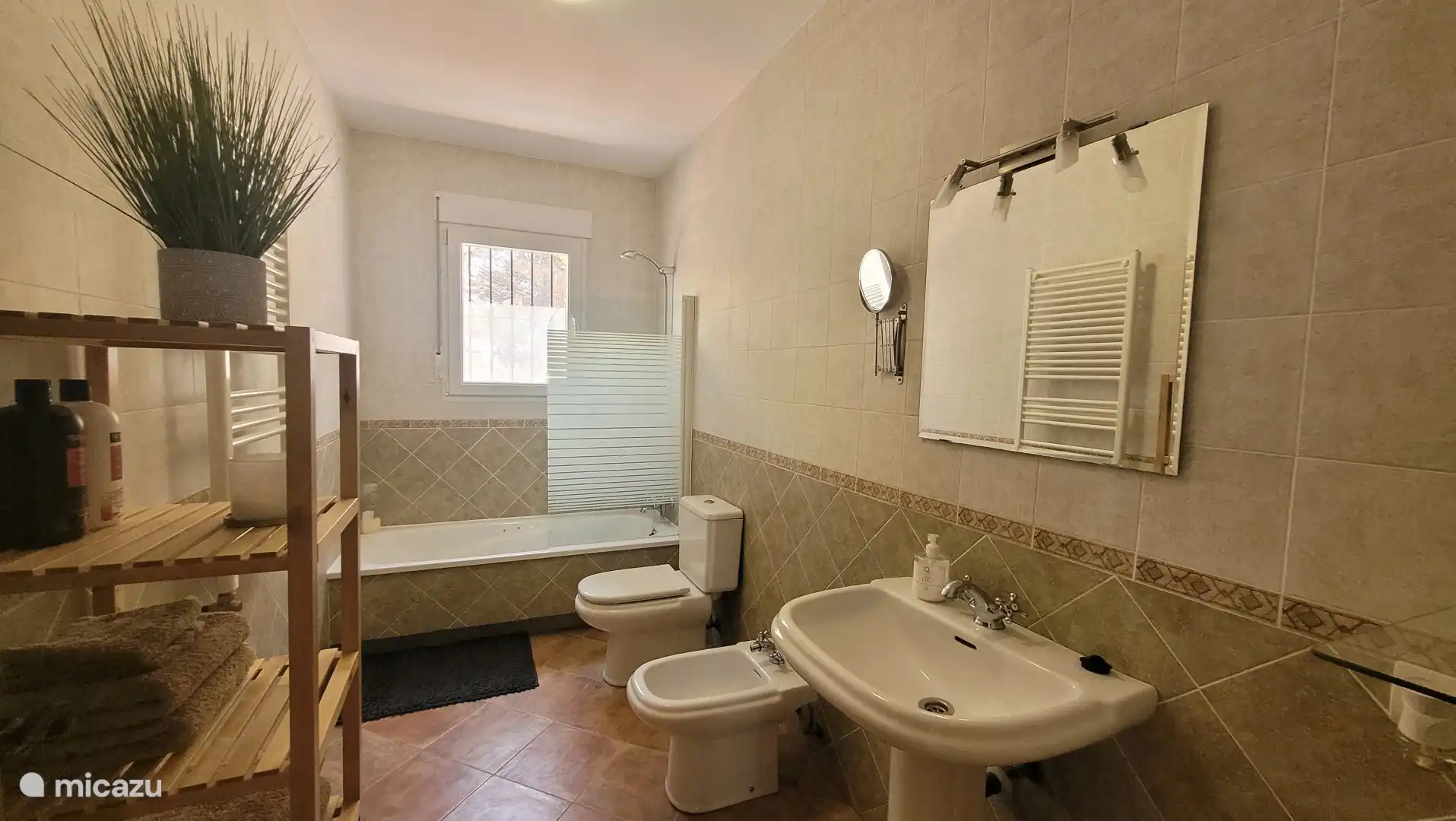 Family bathroom with bathtub