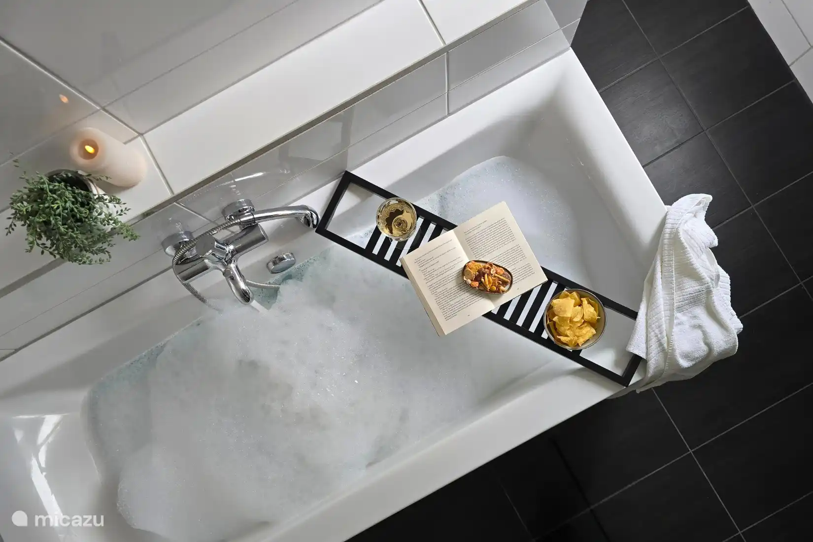 Spacious bathroom with shower, bath and toilet