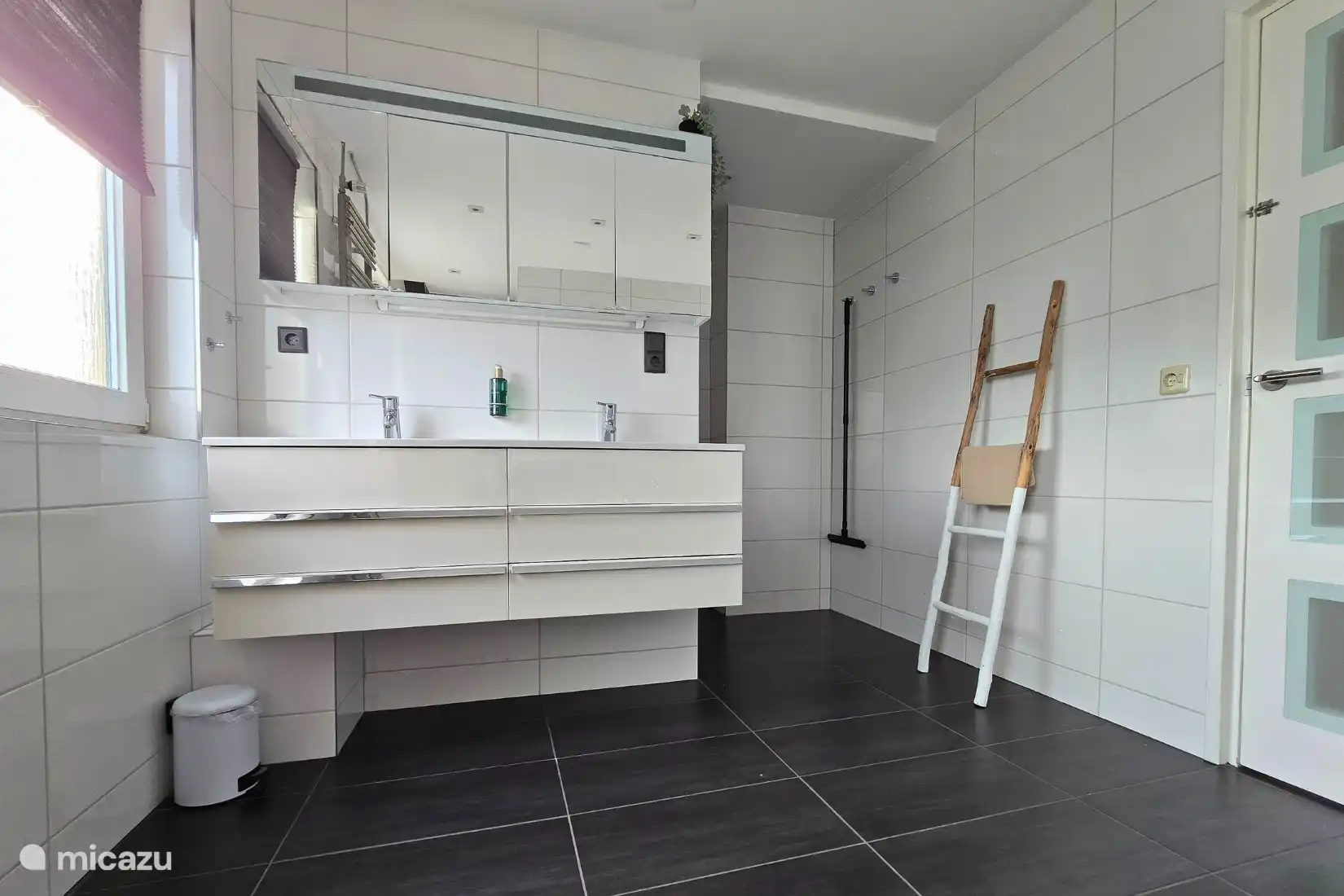 Spacious bathroom with shower, bath and toilet