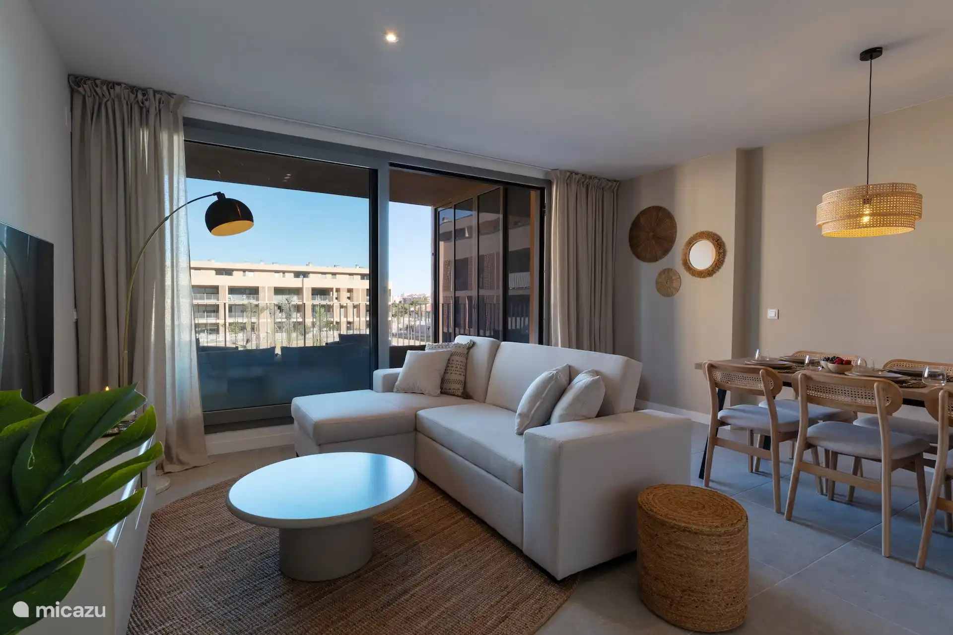 Sitting area living room with dining table with 6 chairs