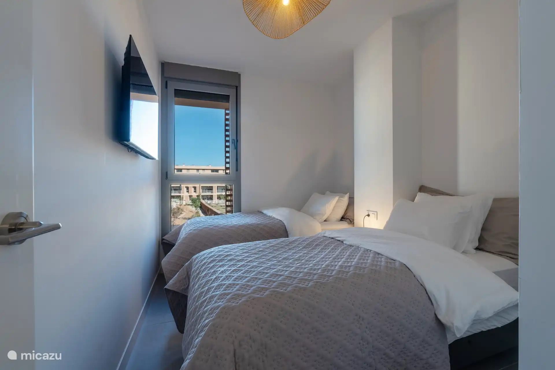 Bedroom with TV, wardrobe (built-in) and flat screen. Two single beds