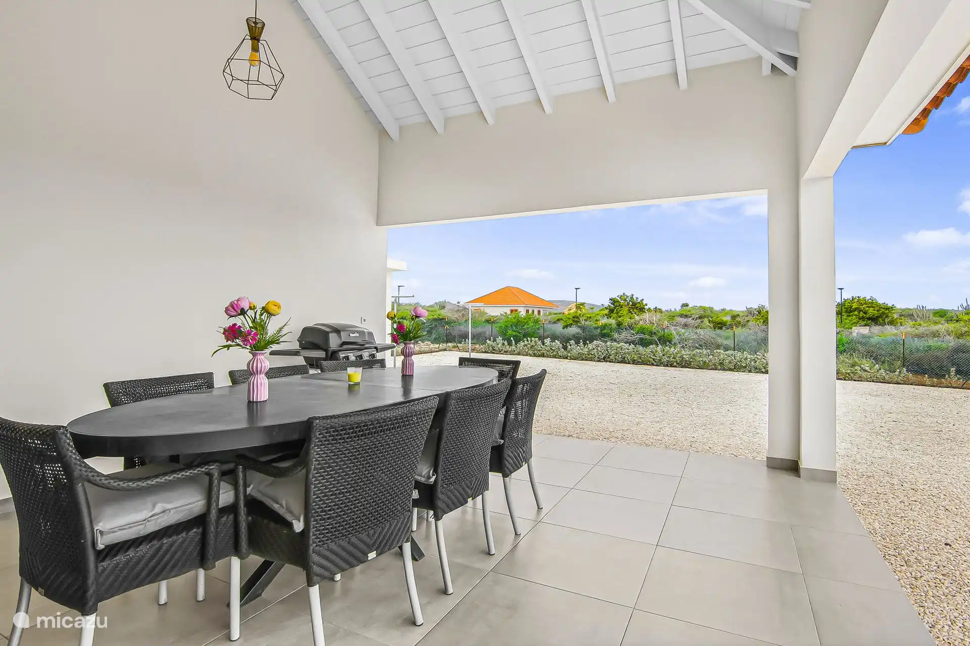 Spacious porch with a view of the garden. Large dining table and bbq available
