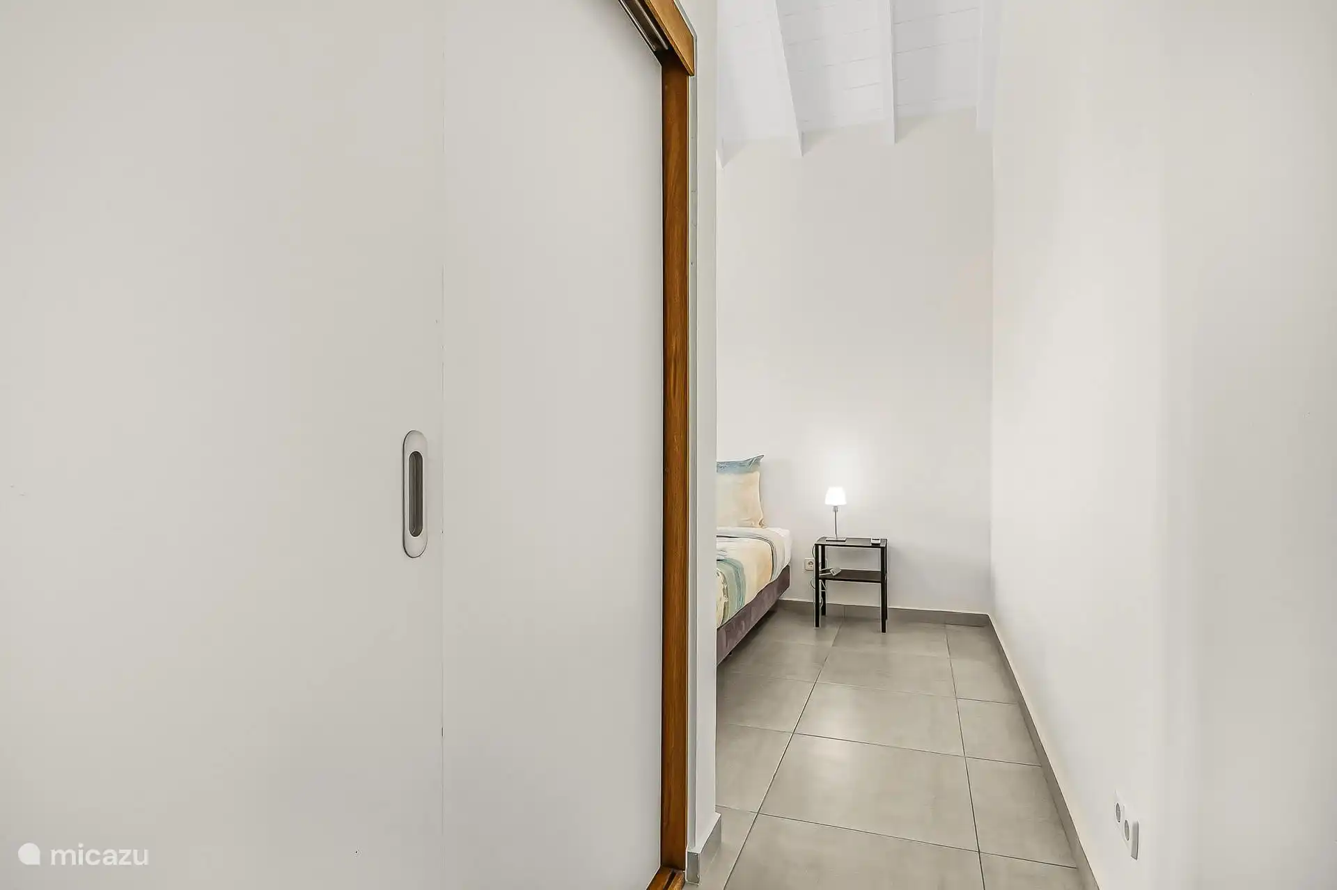 View of the master bedroom with large private wardrobe