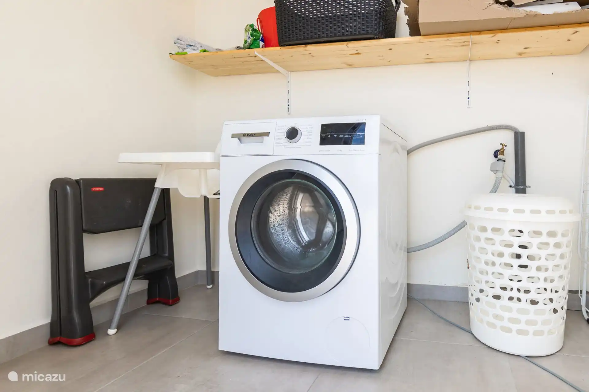 Washing machine room. You can use the private washing machine for free. Only buy your own detergent.