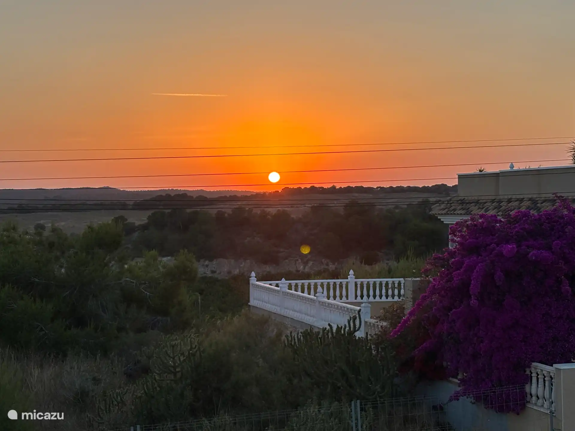 Zonsondergang vanaf dakterras