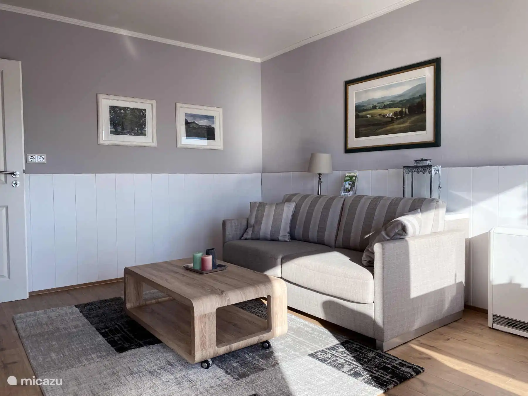 Zithoek in de woonkamer met Colonia slaapbank