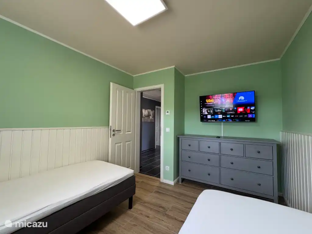 De slaapkamer in Miami met 40 inch tv