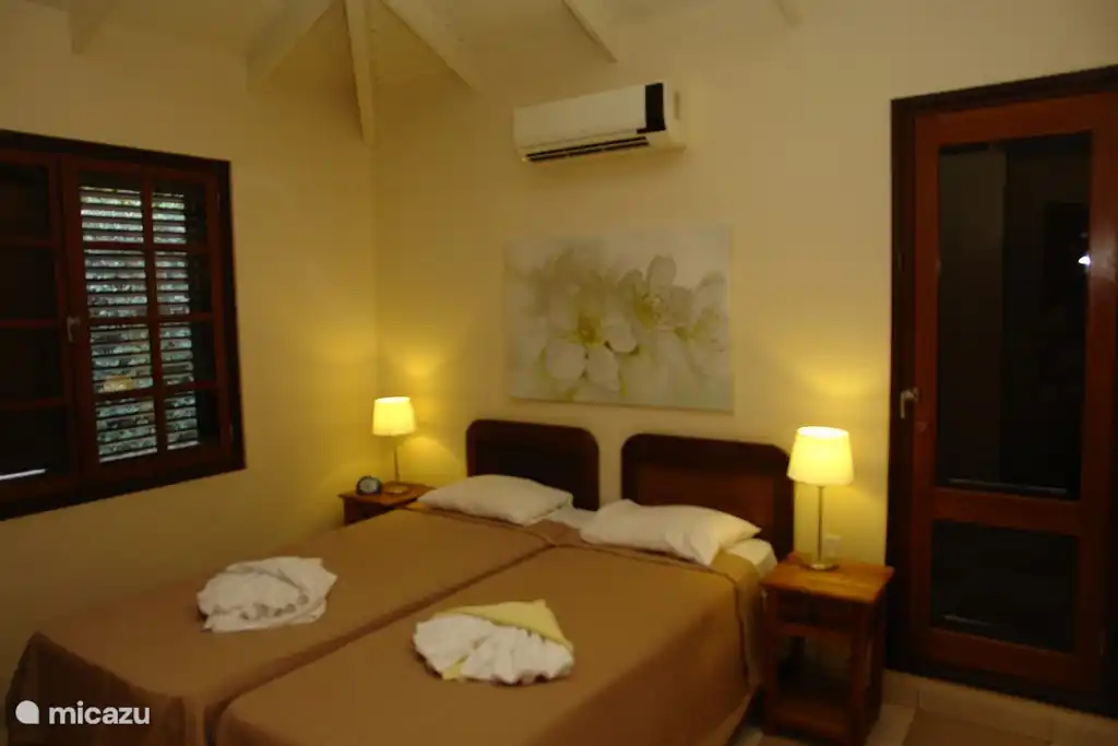 Second bedroom, also equipped with air conditioning, fan, private bathroom with shower and toilet.