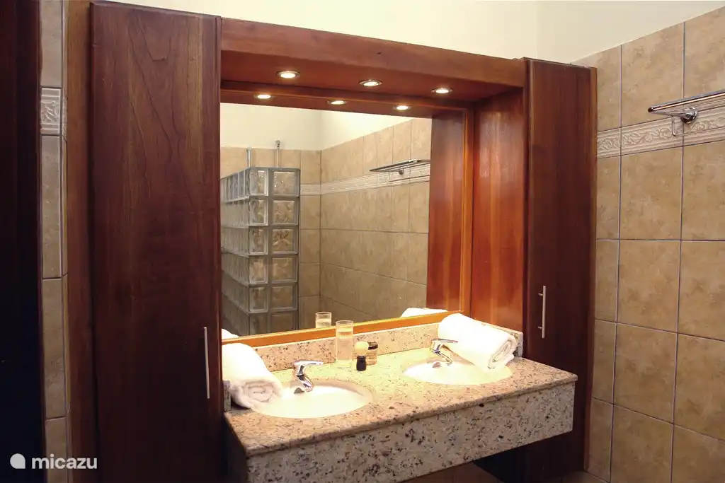 2 bathrooms with hairdryers, toilet and shower.