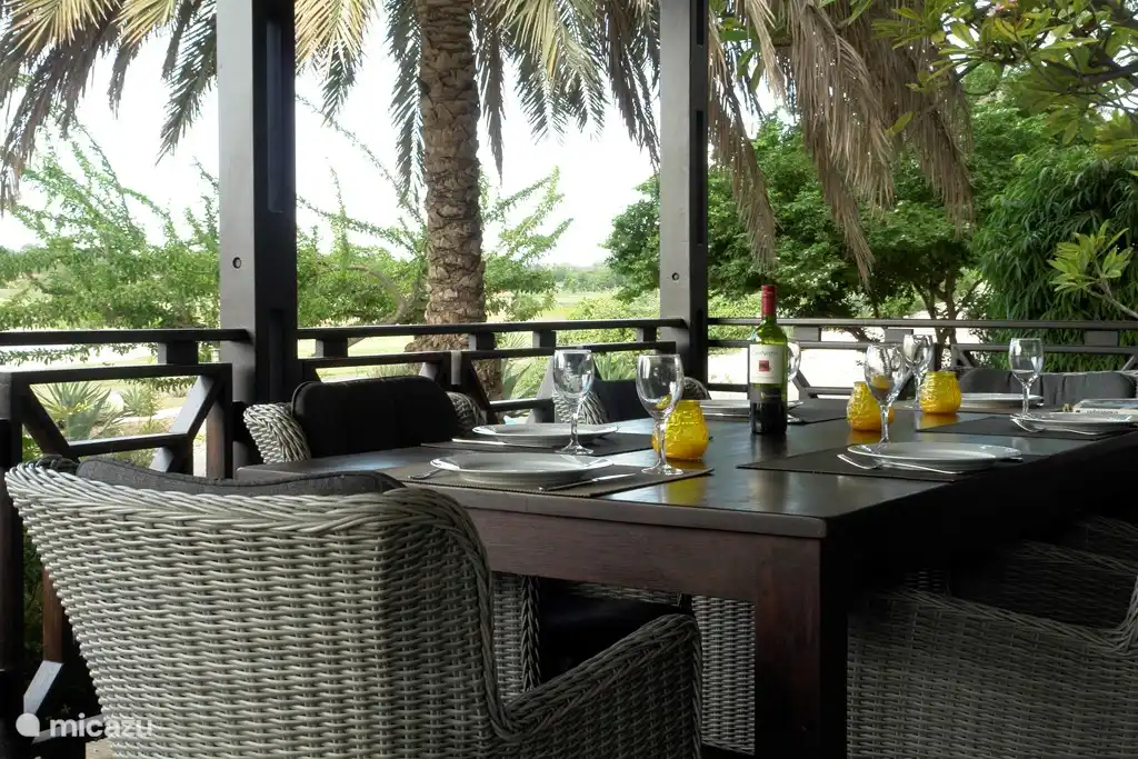Dining with stunning views of tropical greenery.