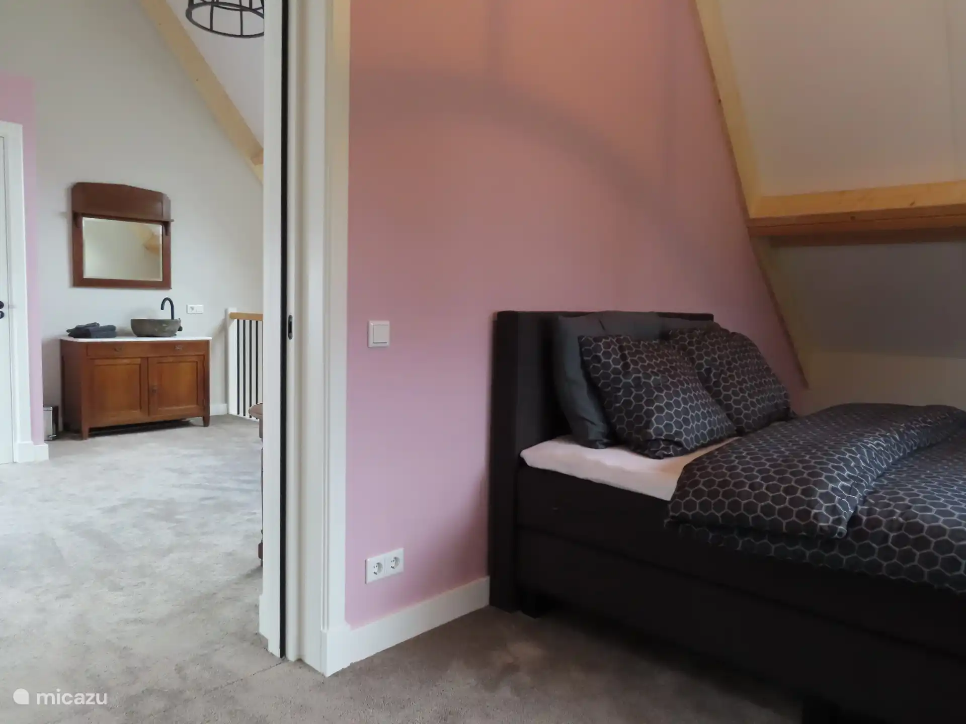 upstairs bedroom with box spring