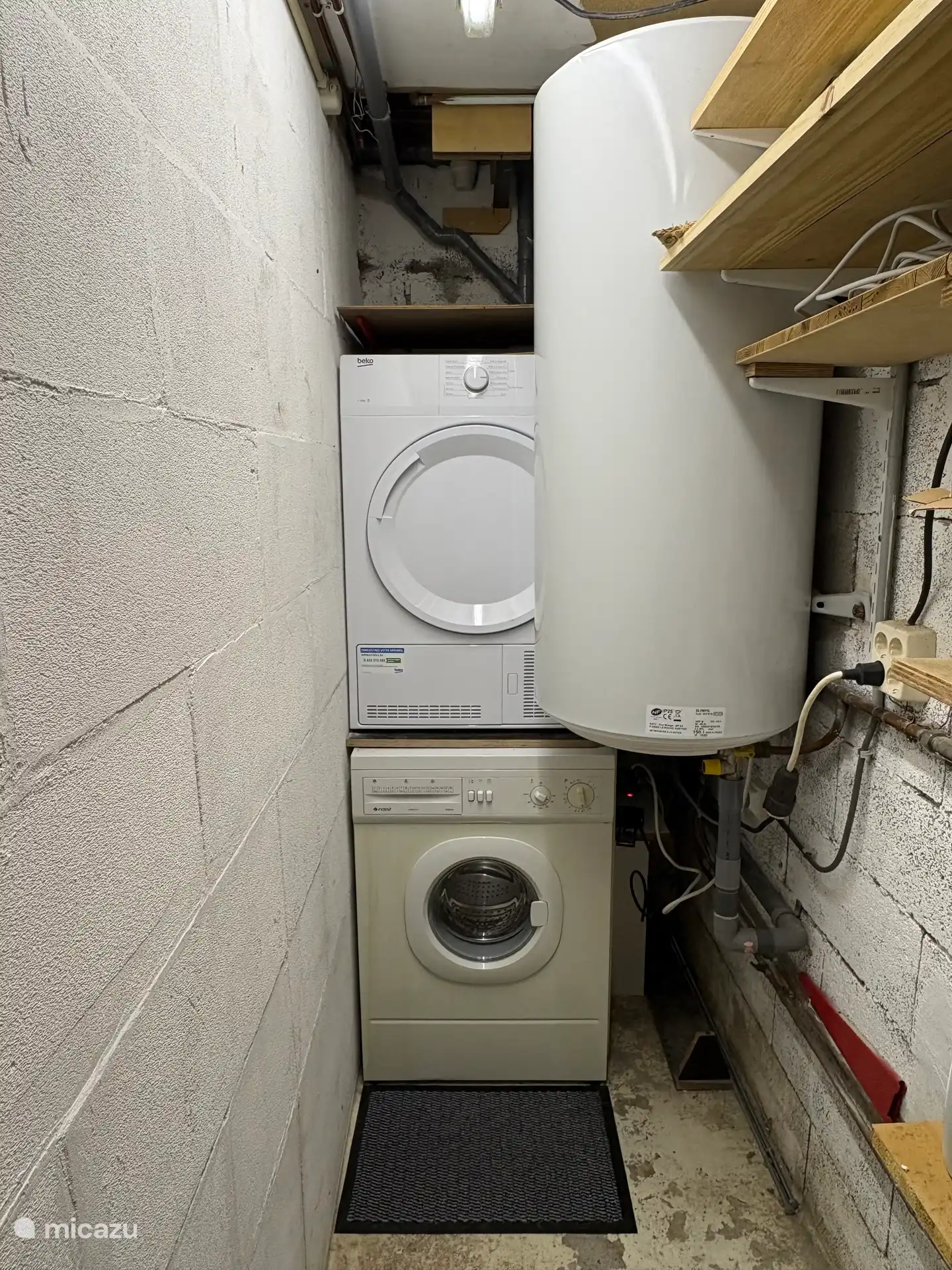 Laundry room accessible from the hallway on the ground floor (same level as the bedrooms)