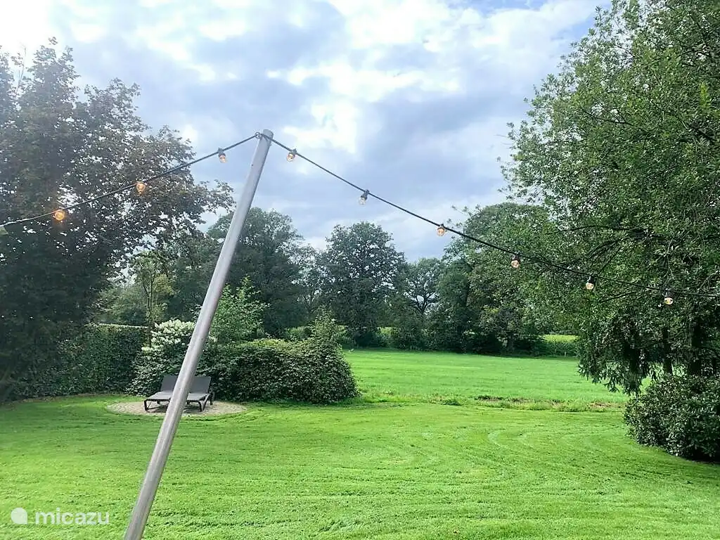 Een tuin vol privacy en uitzicht over de Achterhoekse velden