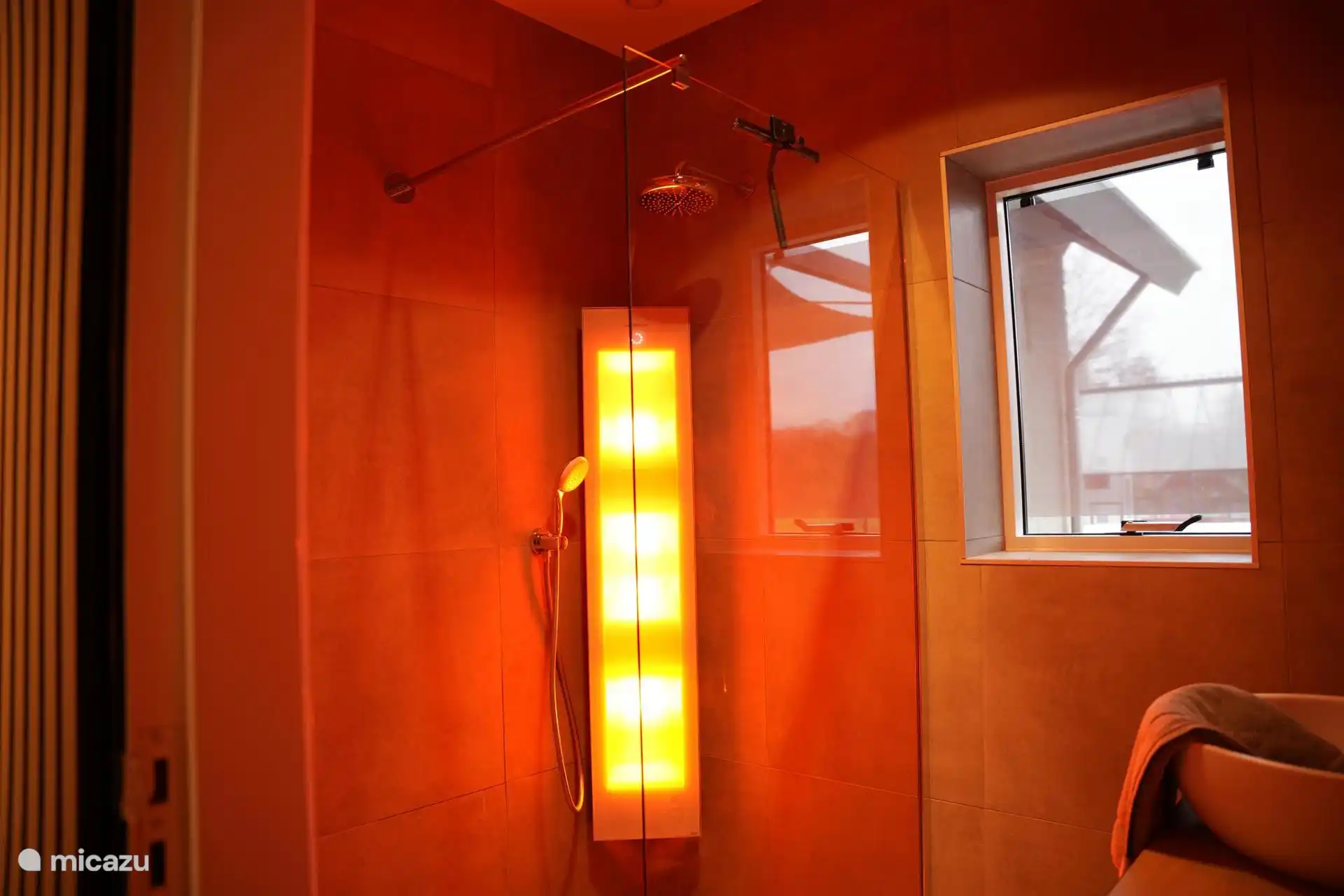 De badkamer met Sunshower