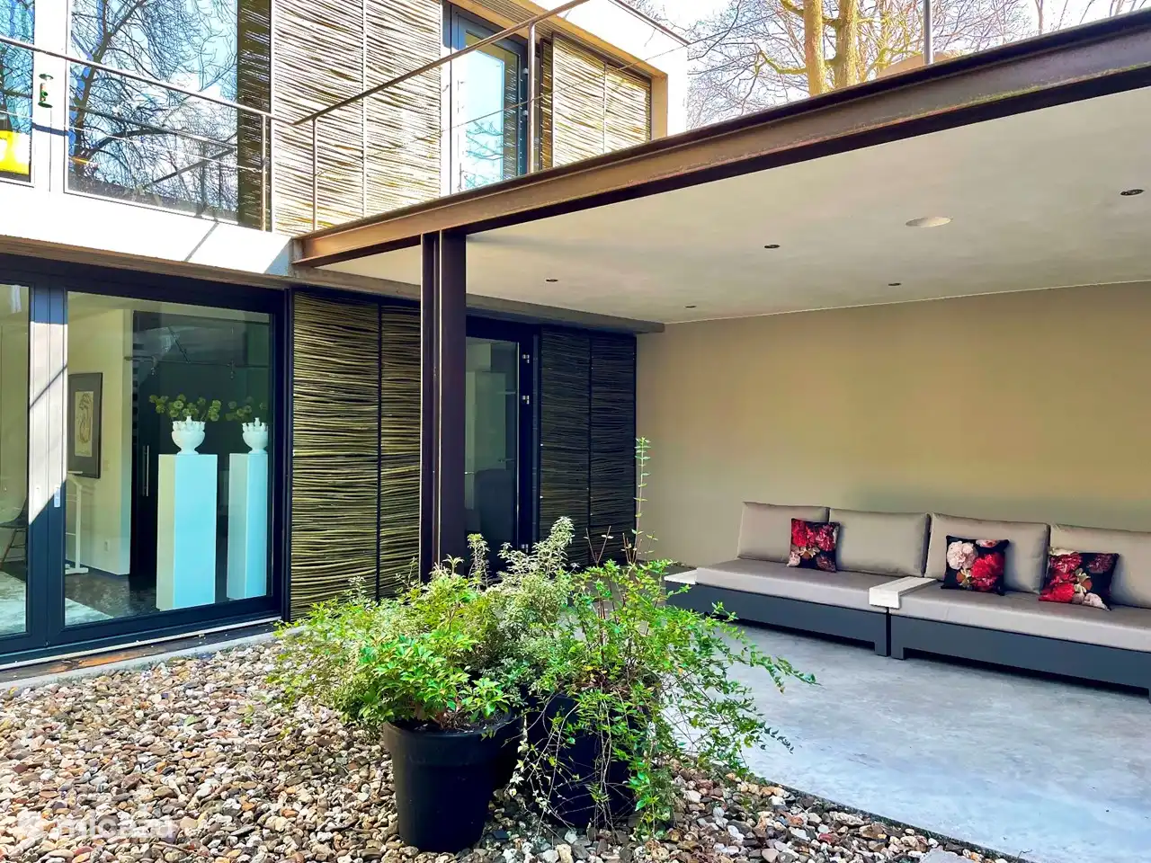 Outdoor terrace downstairs with lounge sofa