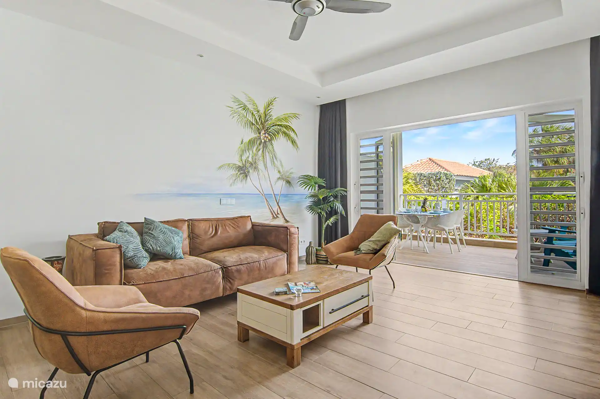 Lovely spacious living room with patio doors to the terrace overlooking the tropical garden and lots of privacy.
