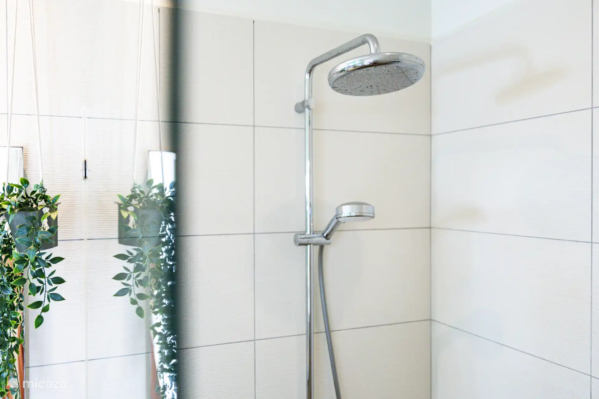 A spacious bathroom with amenities such as shampoo, conditioner and shower gel, washing machine and dryer and of course fine towels. 