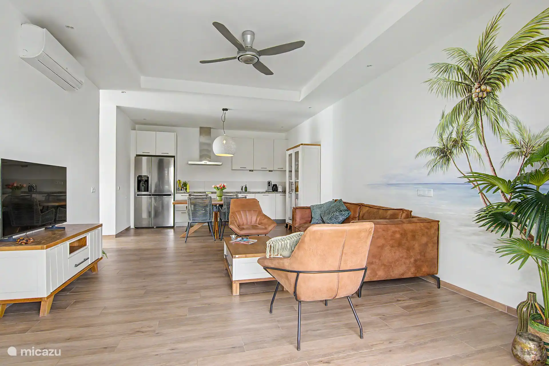 Lovely spacious living room with patio doors to the terrace overlooking the tropical garden and lots of privacy.